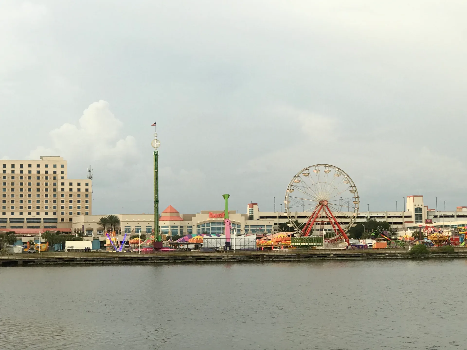 Waterfront carnival scene in Biloxi with ferris wheel