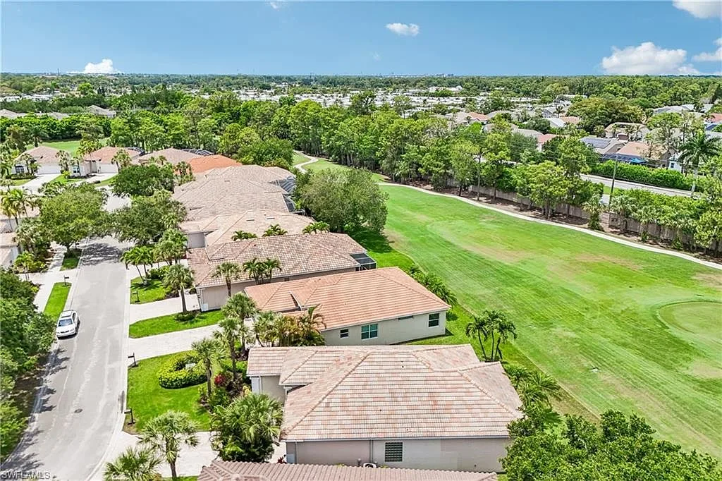 Aerial view over the Glen Eagle golf course fairway and neighborhood