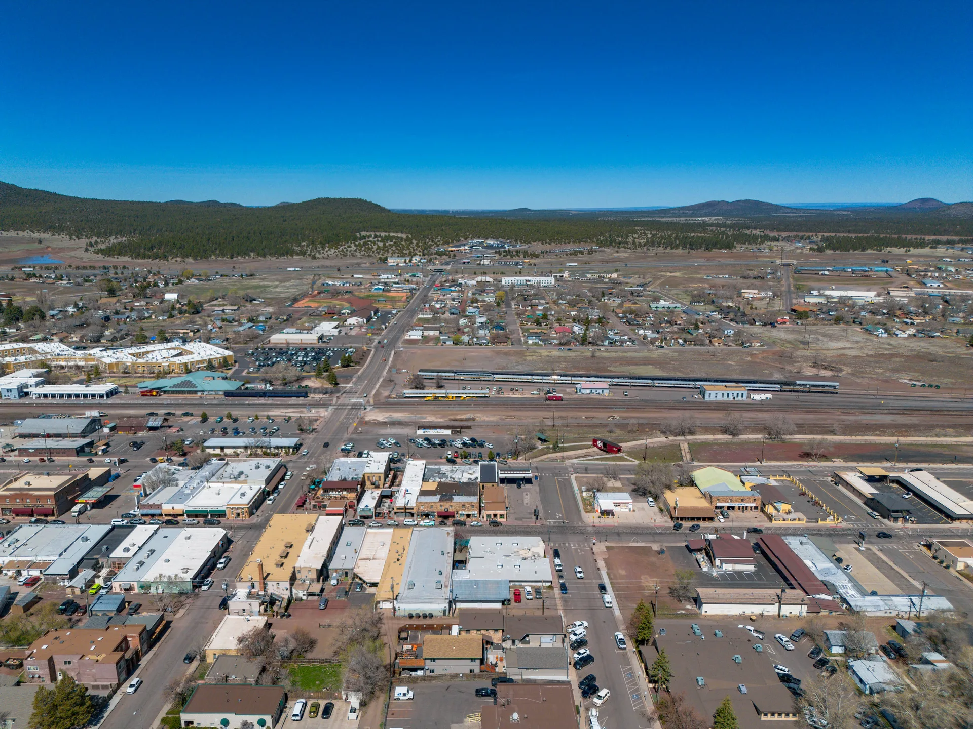 Aerial view of Williams, Arizona with mountain backdrop and historic downtown