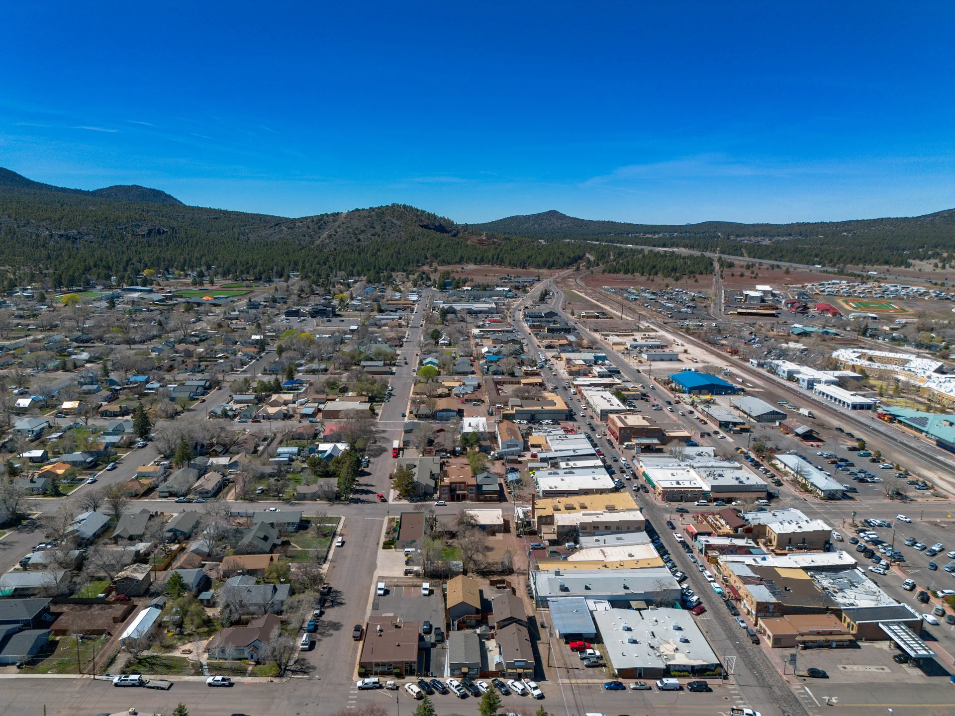 Aerial view of downtown Williams, Arizona showing the town grid and mountain backdrop