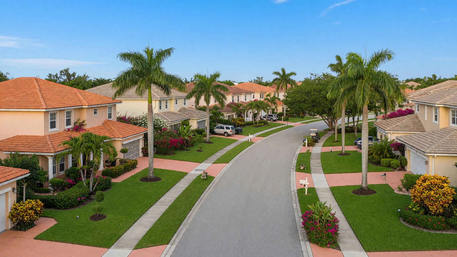 A quiet Palm Beach County residential street lined with well-maintained homes and tropical landscaping