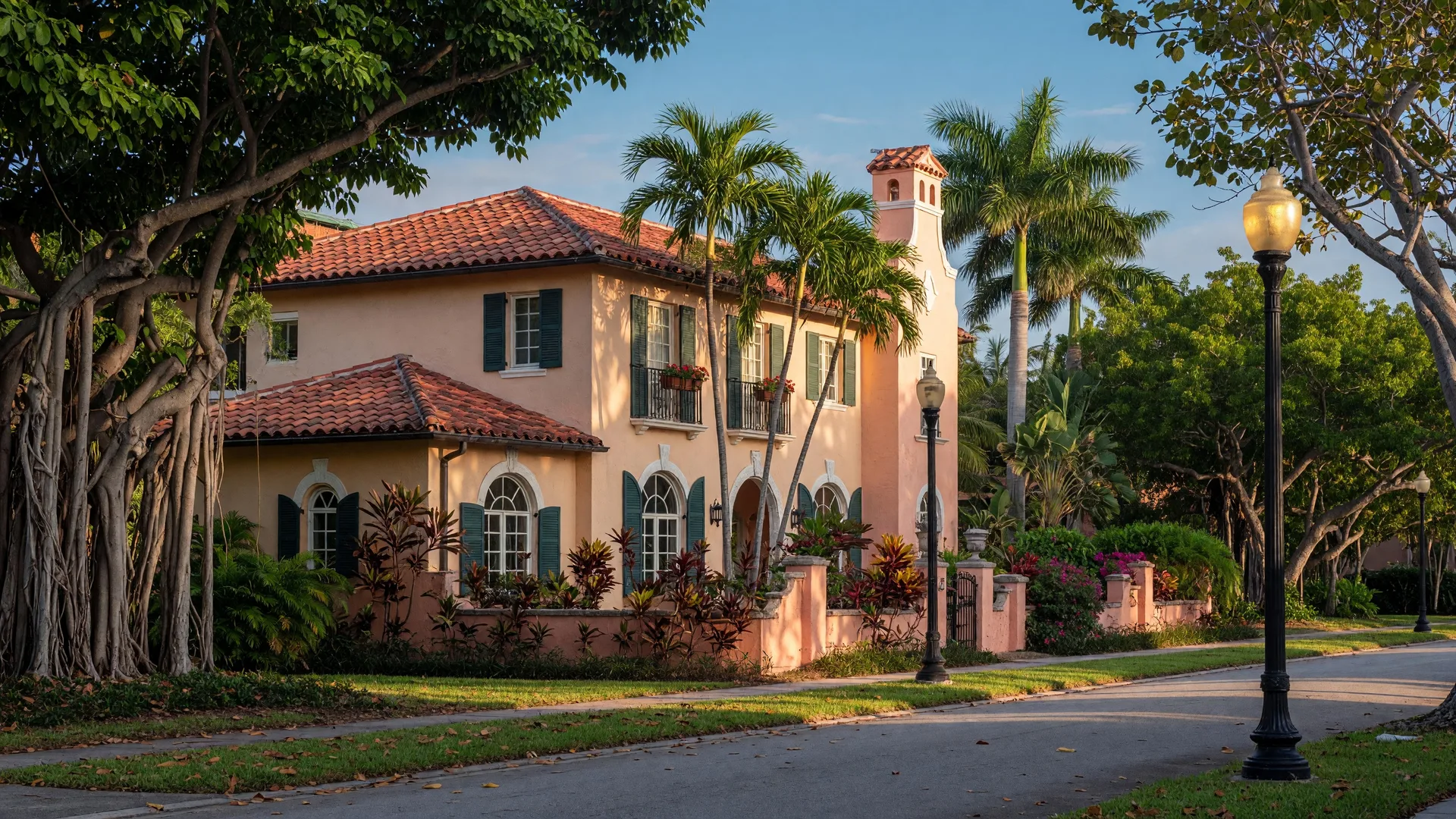 Historic Mediterranean Revival home in the Delray Beach Historic District with terracotta roof, arched windows, and tropical landscaping