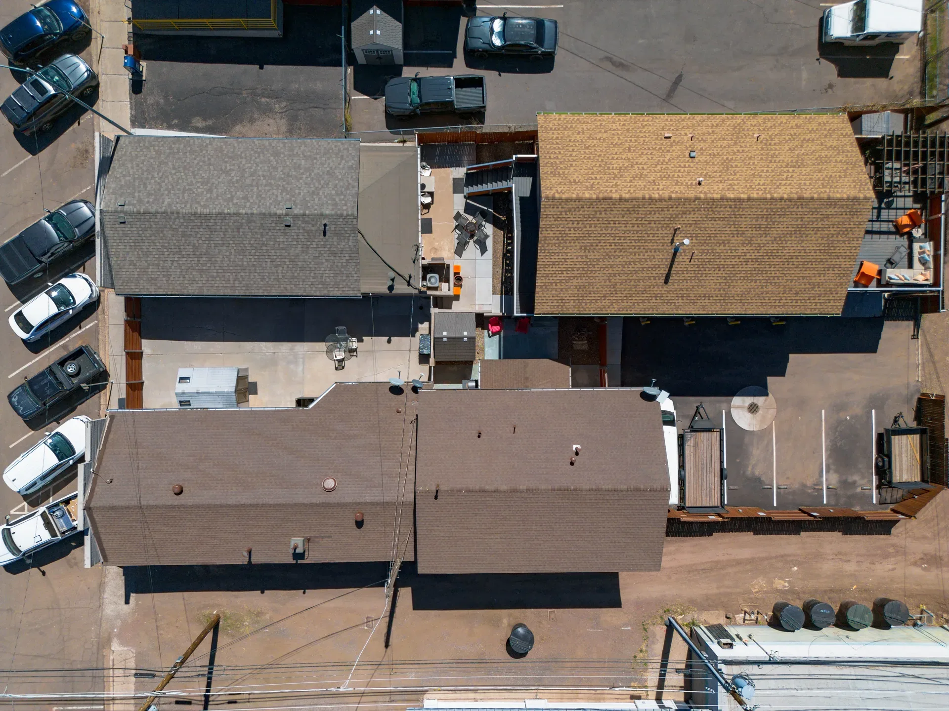 Top-down drone capture of the property showing building footprint and parking area