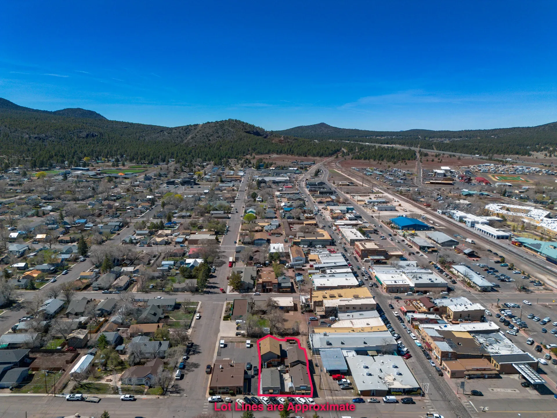High-altitude aerial overlooking the property within the downtown Williams grid