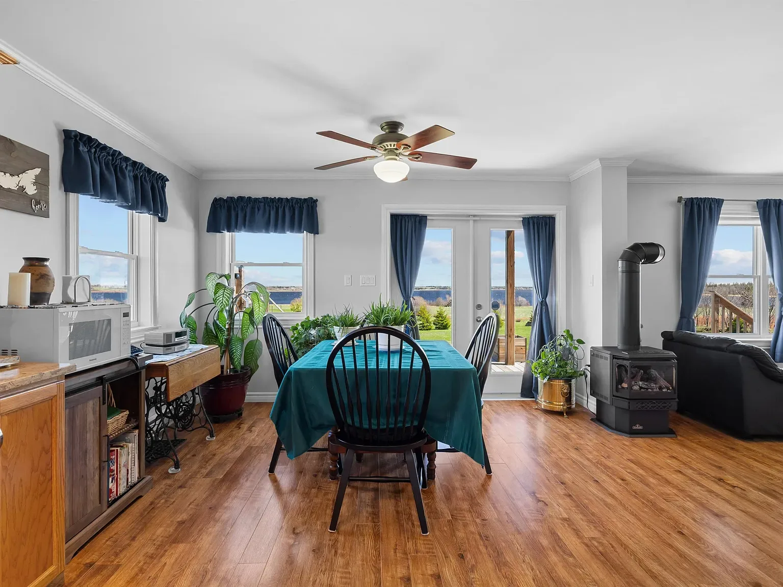 Open-concept dining and living area with bay view