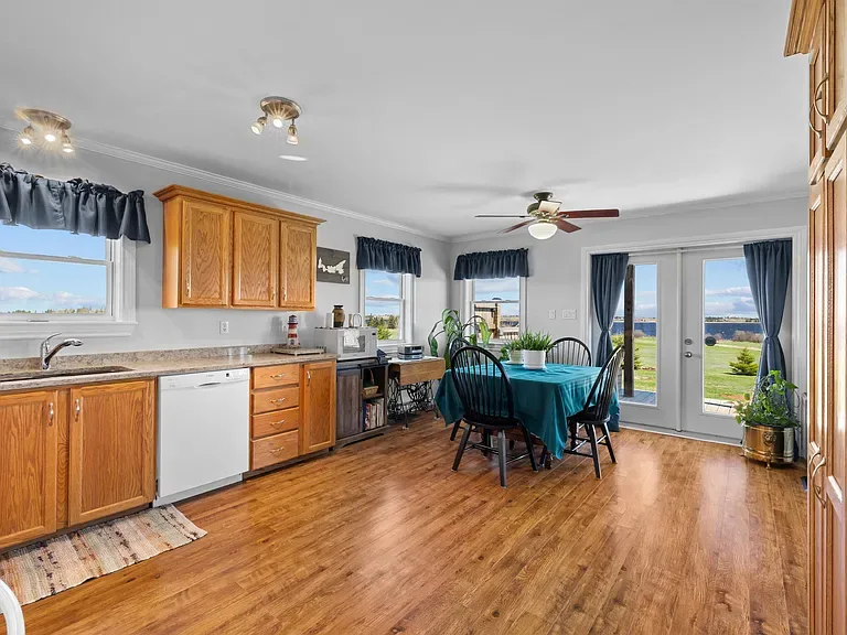 Kitchen with light wood cabinetry and bay views