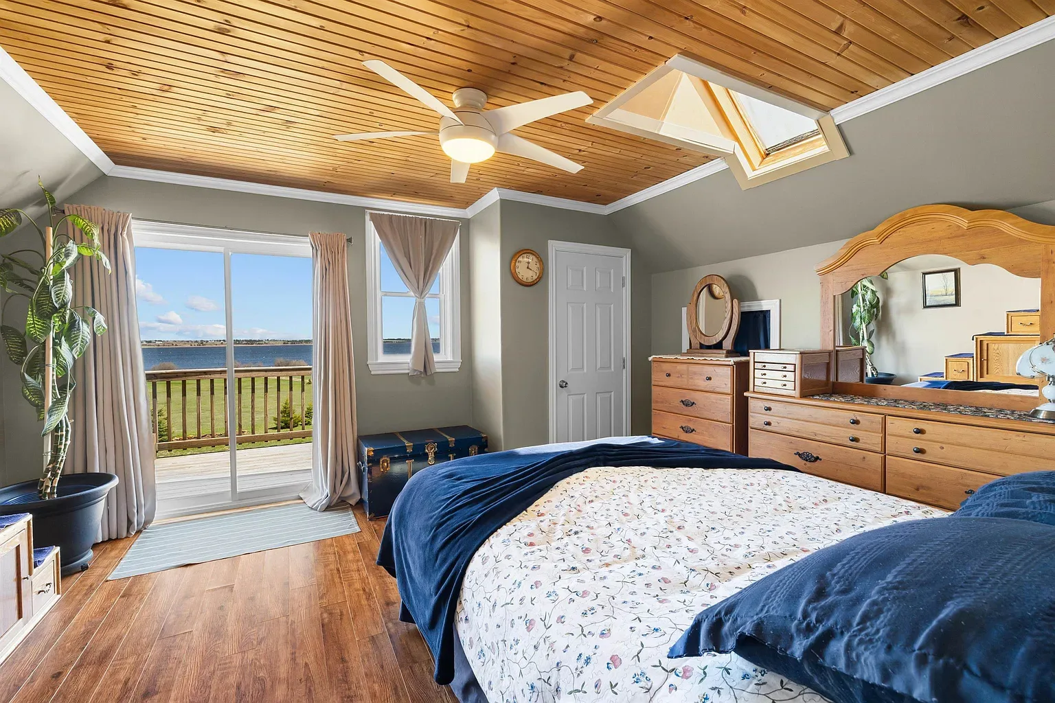Primary suite with balcony access and bay views