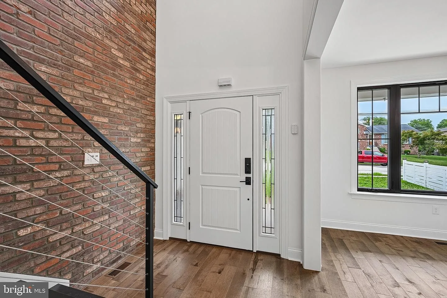 Two-story foyer with Castle Gate brick accent wall
