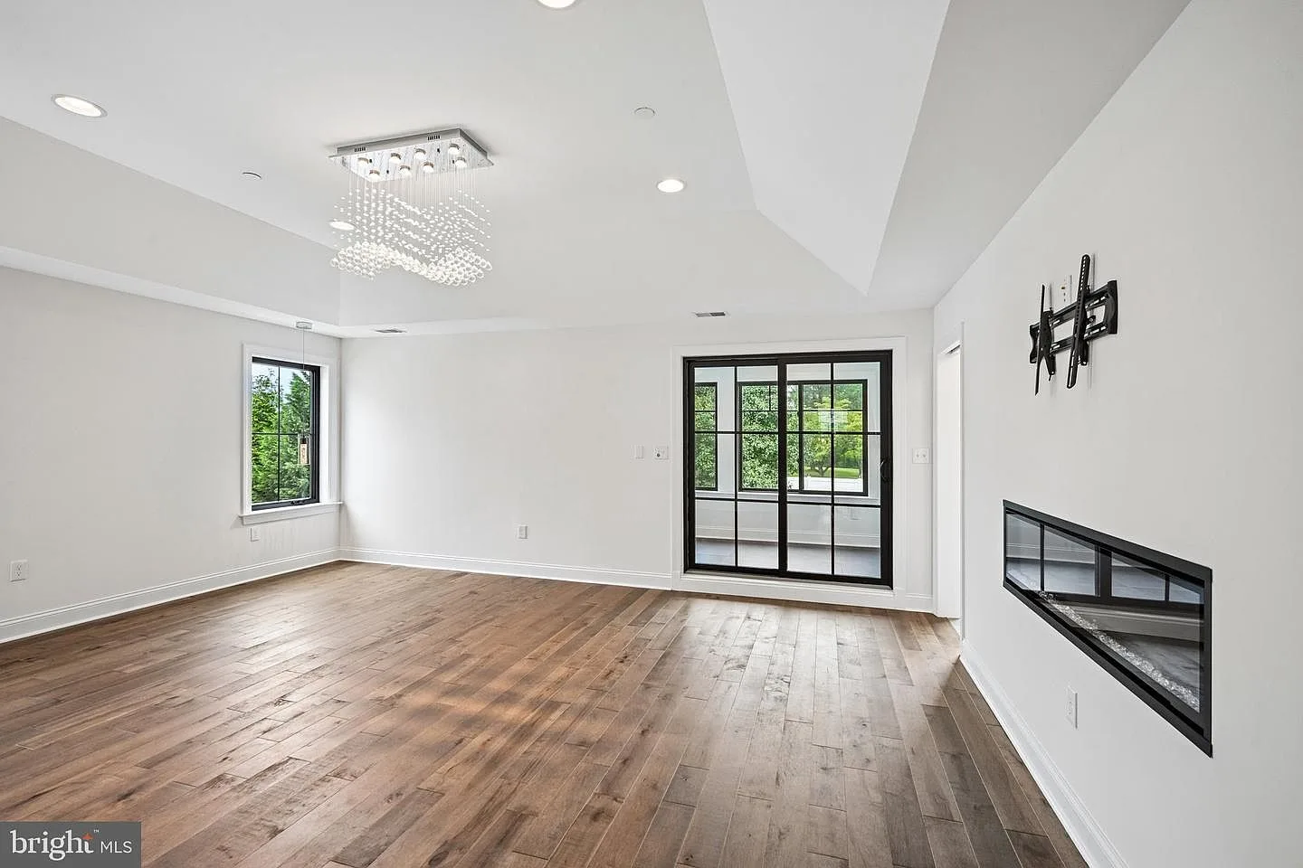 Primary bedroom with designer chandelier