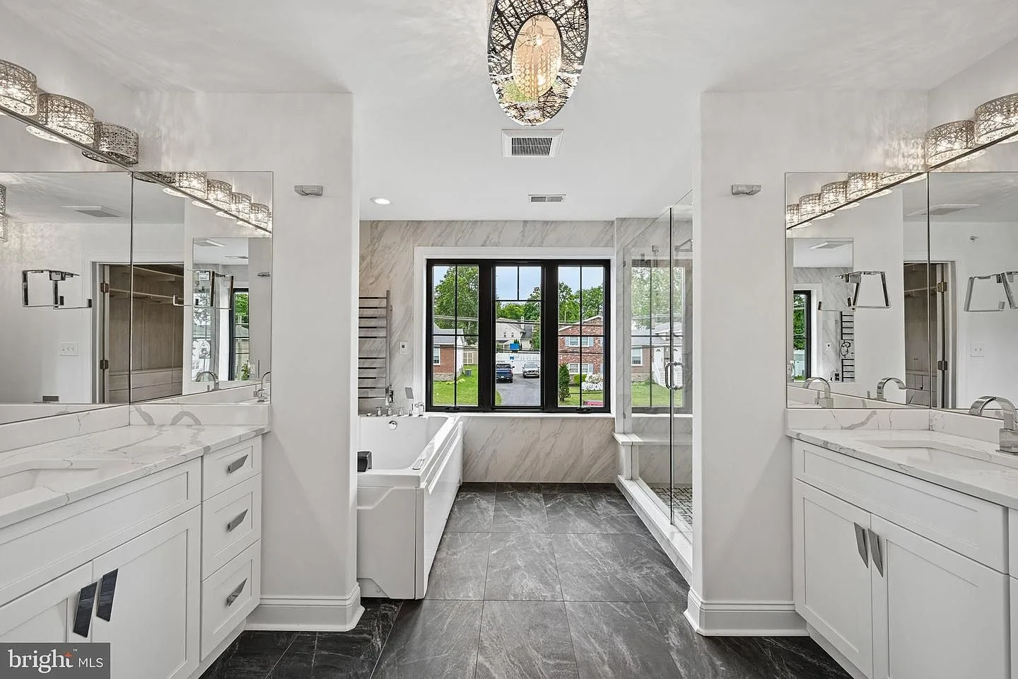 Spa-inspired primary bathroom with dual vanities