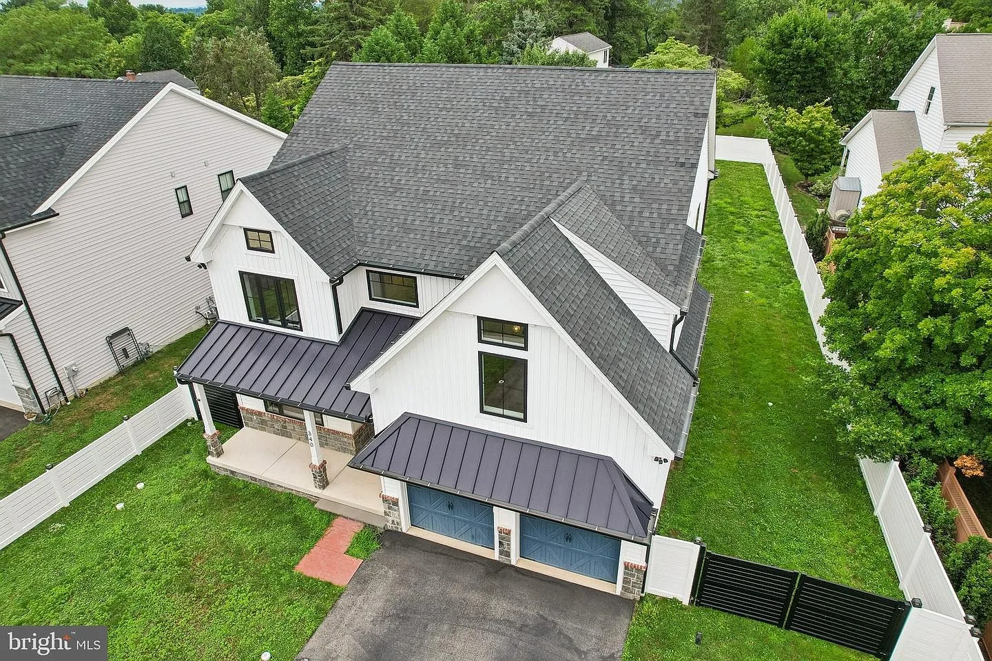 High-angle view of facade and side yard