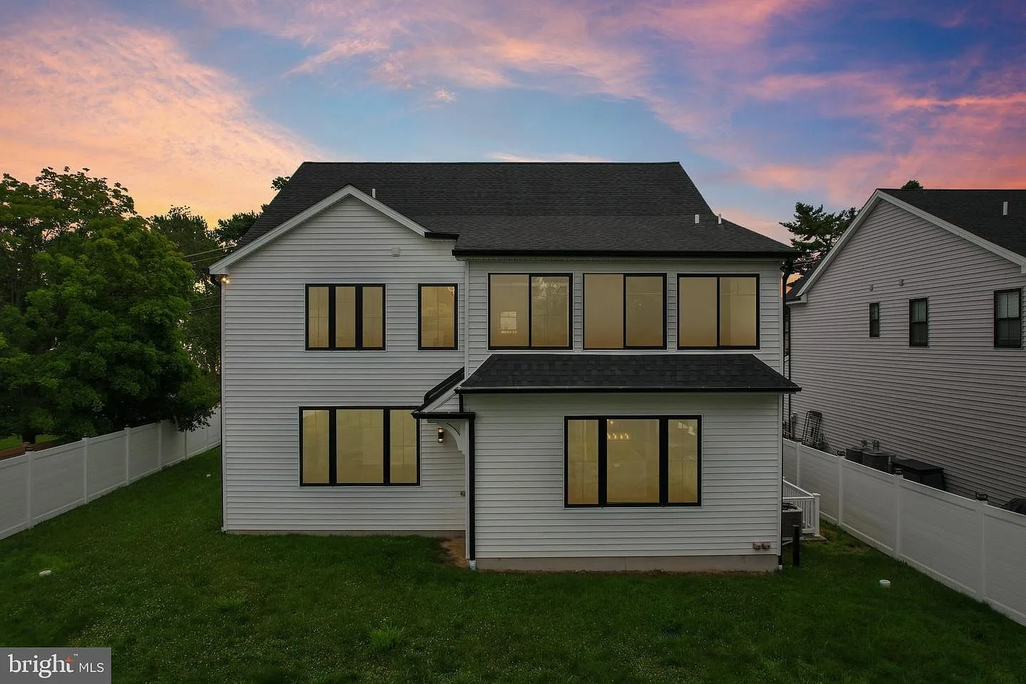 Rear facade at sunset with glowing windows