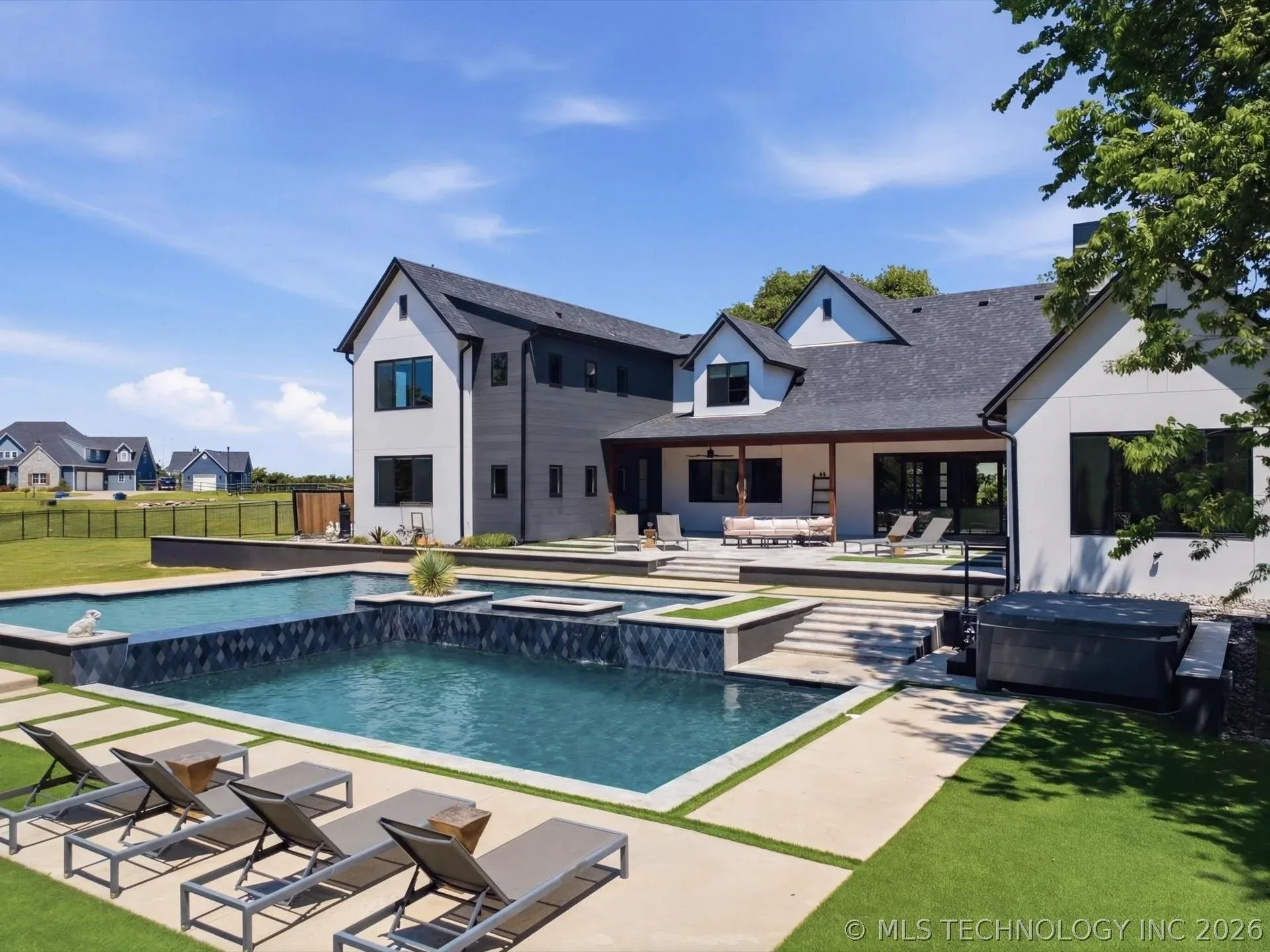 Backyard pool and patio area at 17120 E Sunset Ridge in Owasso, Oklahoma