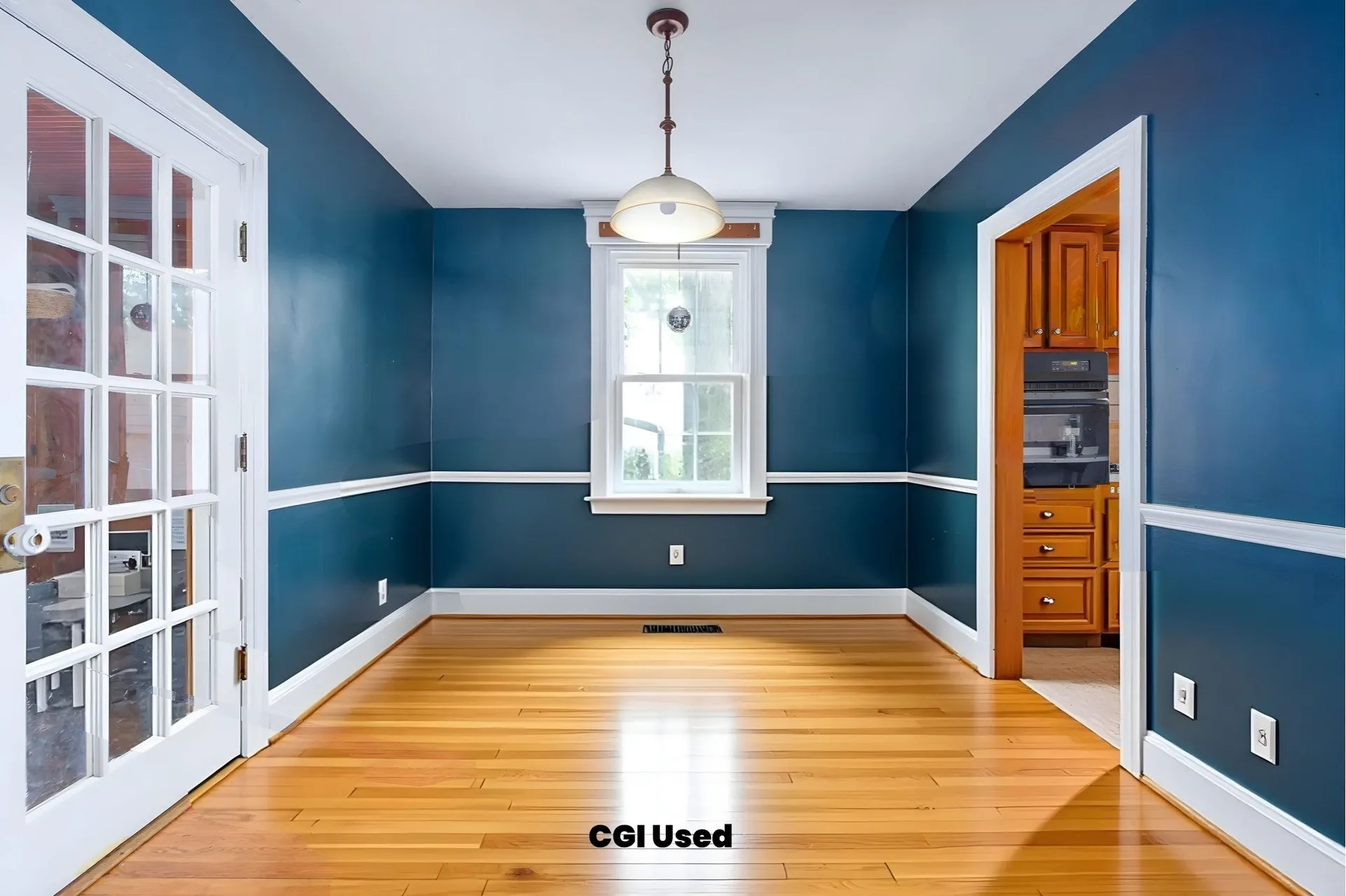 Dining room with refinished hardwood floors and wainscoting