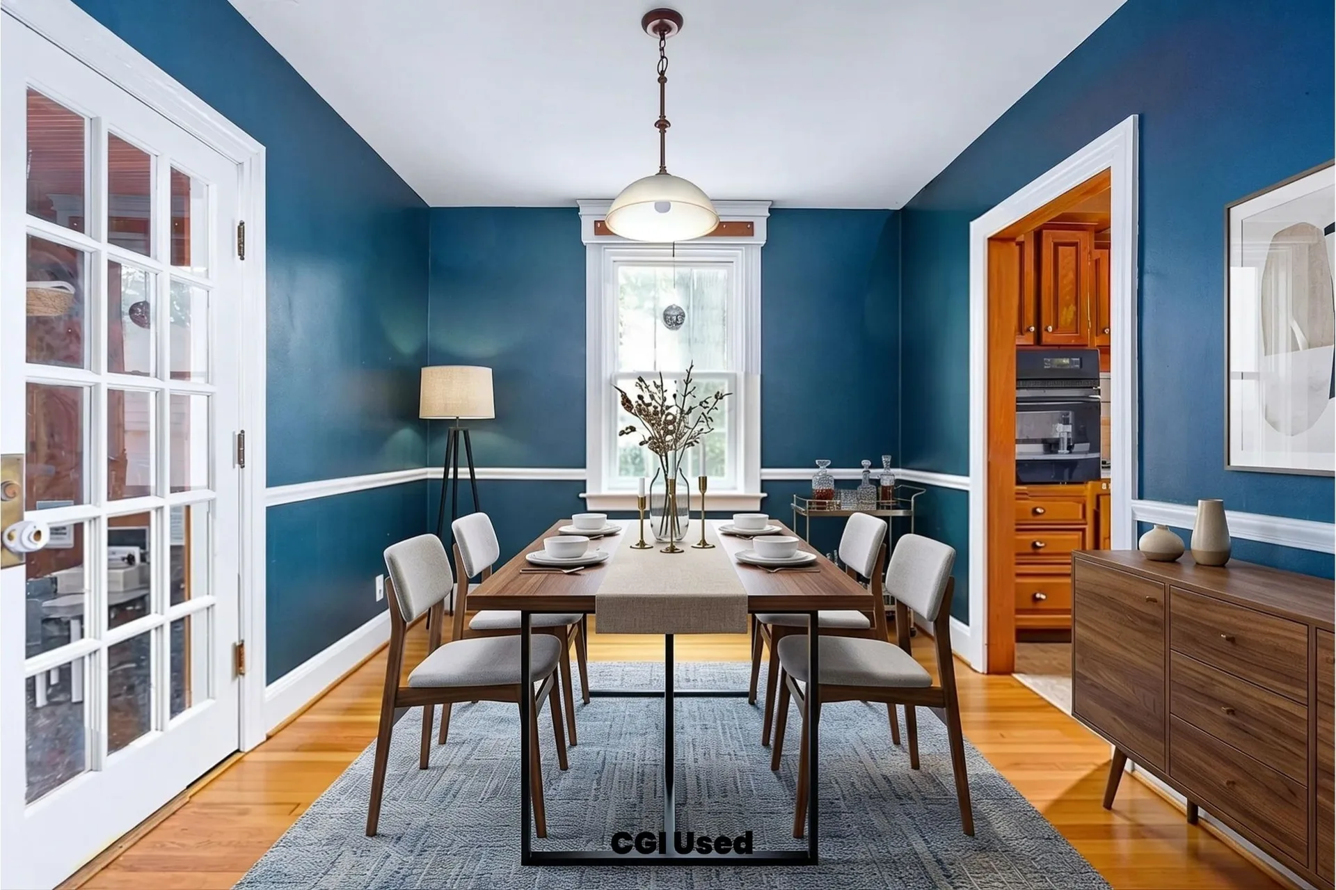 Dining room showing hardwood floors, blue walls and white trim