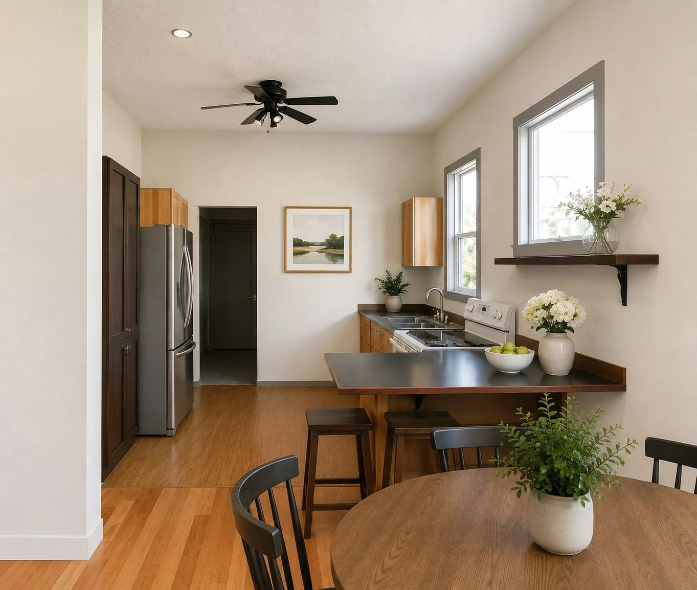 Kitchen with eat-in dining area and hardwood floors