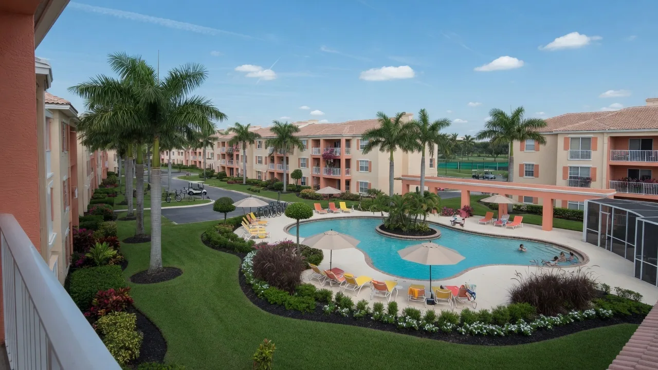 South Florida condo community with pool and palm trees