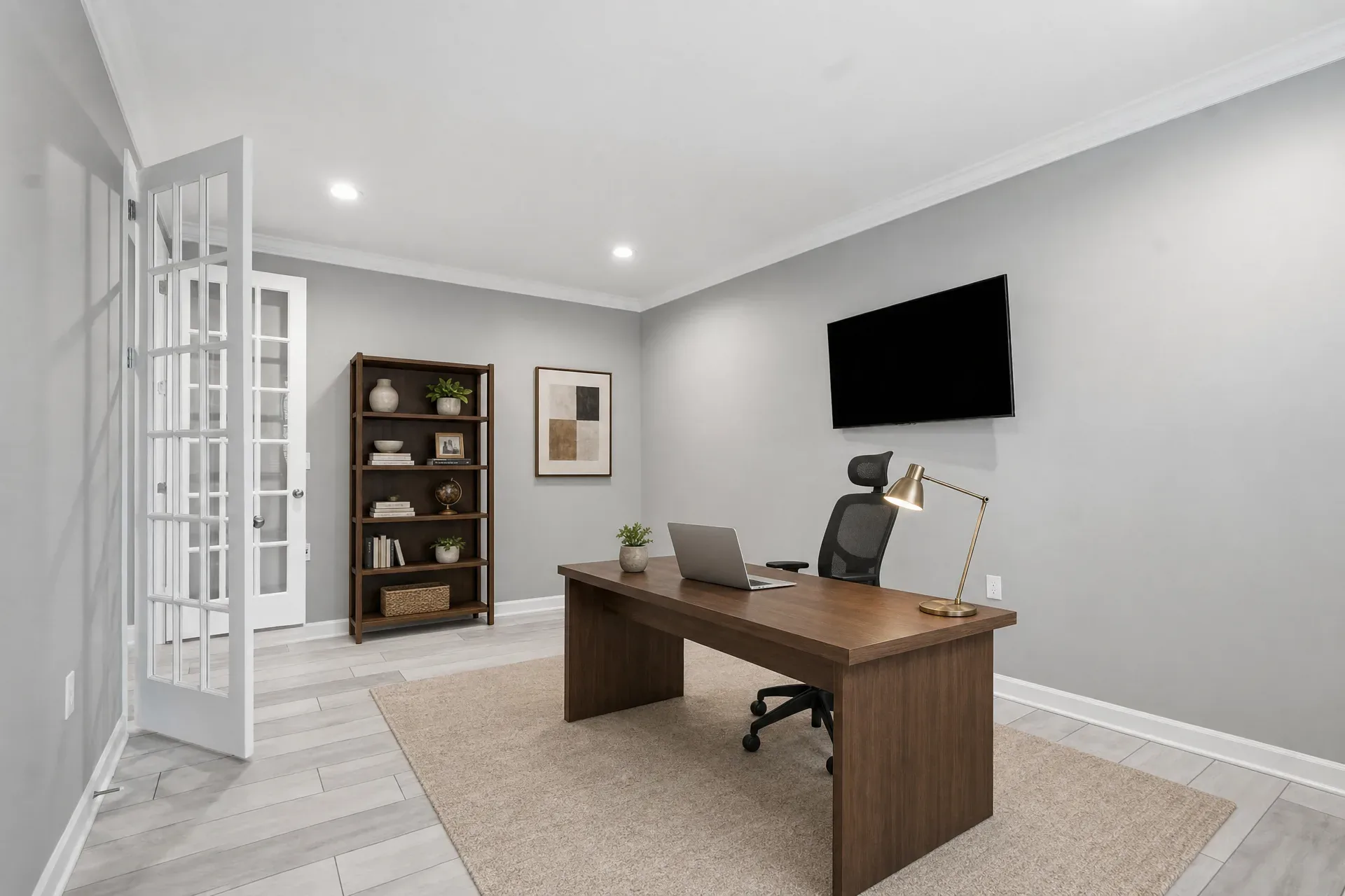 Home office study at 297 Bonaventure Dr with built-in bookshelves and natural lighting