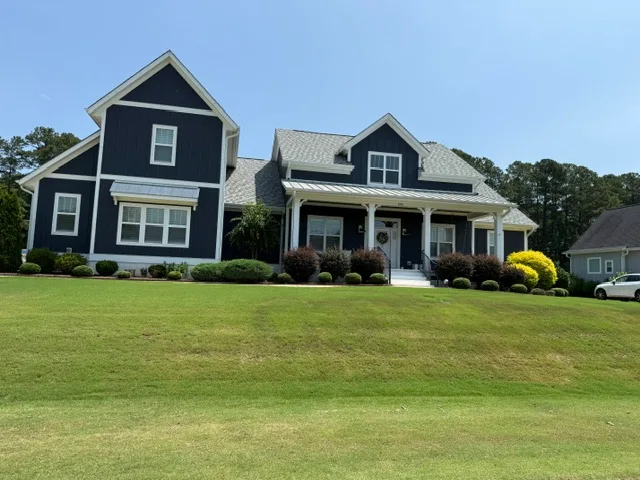 Exterior facade with navy siding at Portofino community