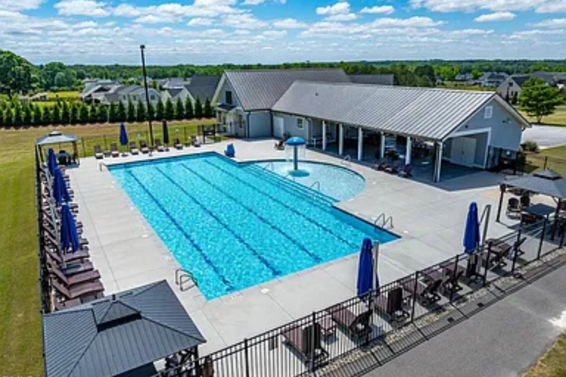 Portofino community pool facility with sparkling water and lounge areas