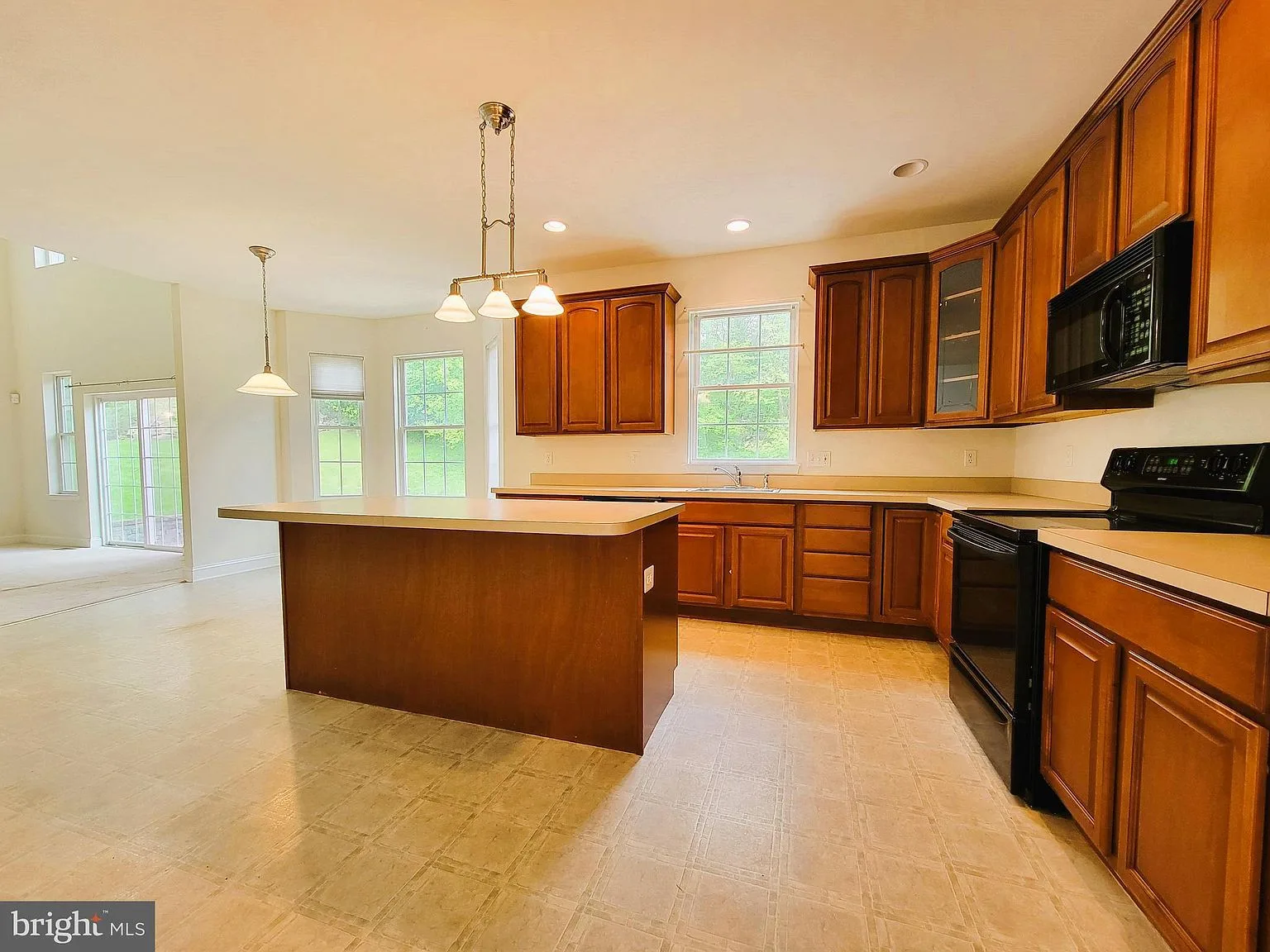 Kitchen with oak cabinetry and center island
