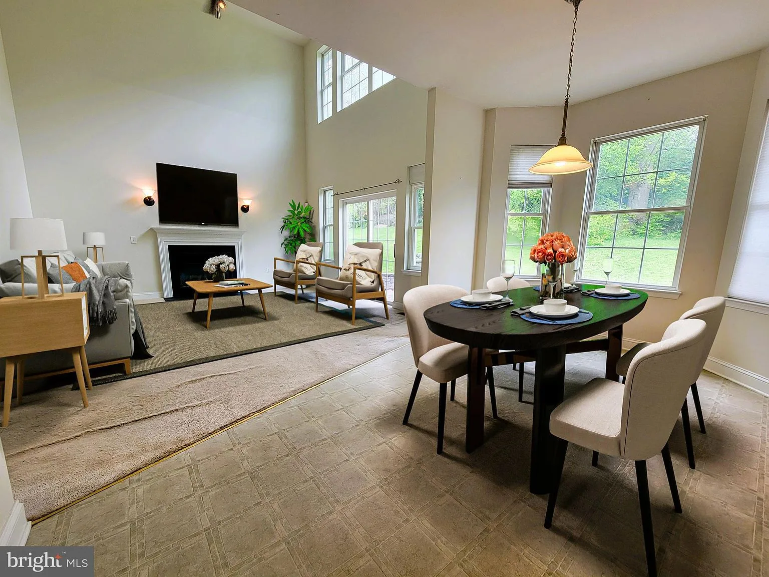 Open-concept living and dining with vaulted ceilings