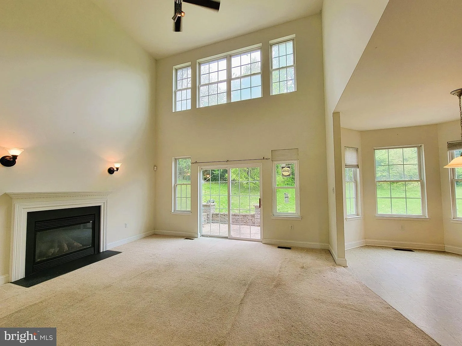Living room with vaulted ceiling and fireplace