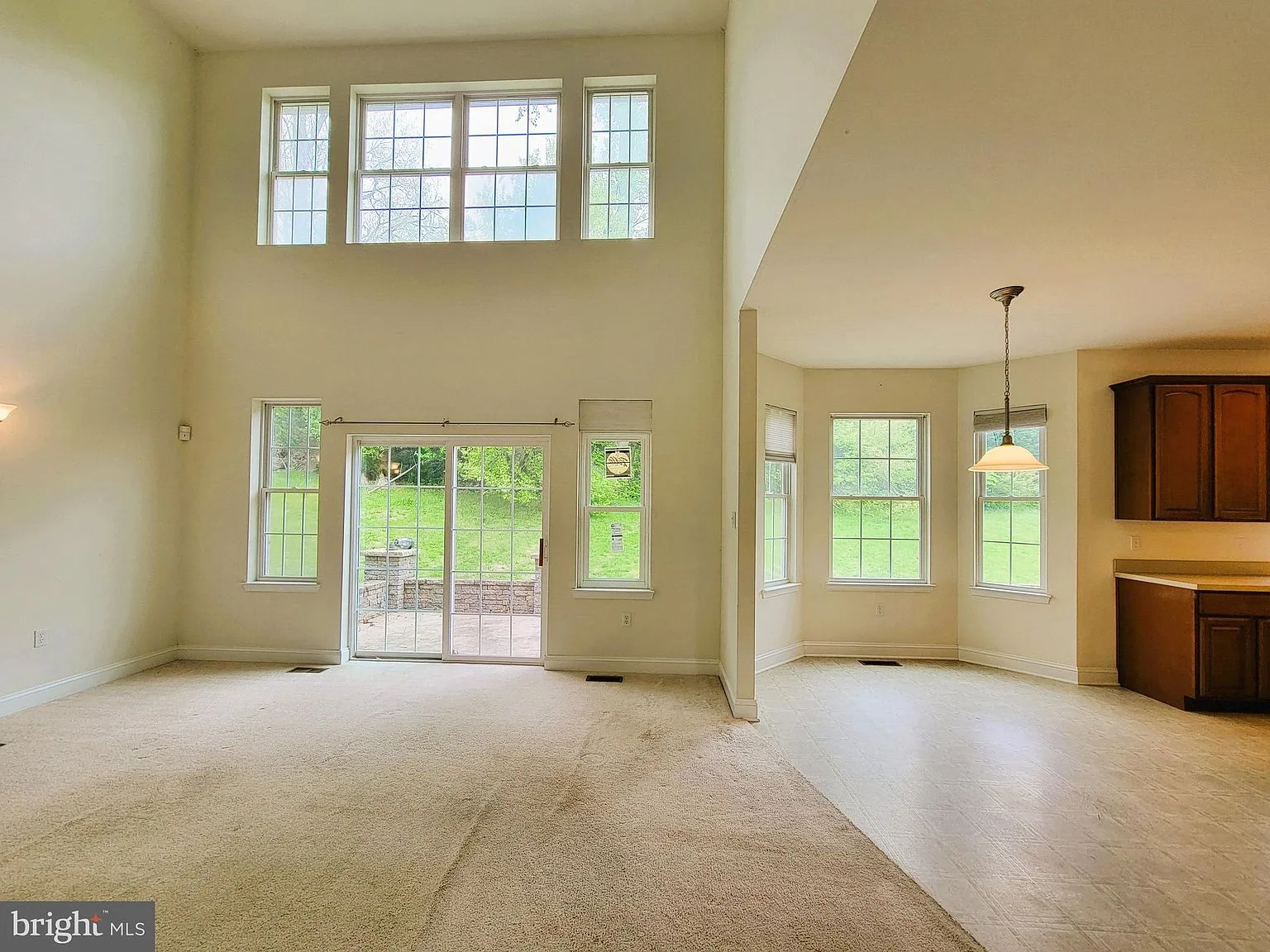 Living and dining combo with high ceilings