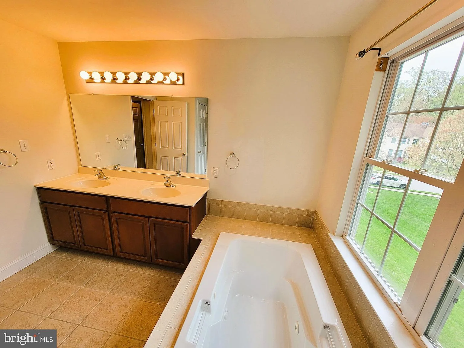 Primary bathroom with vanity and tub