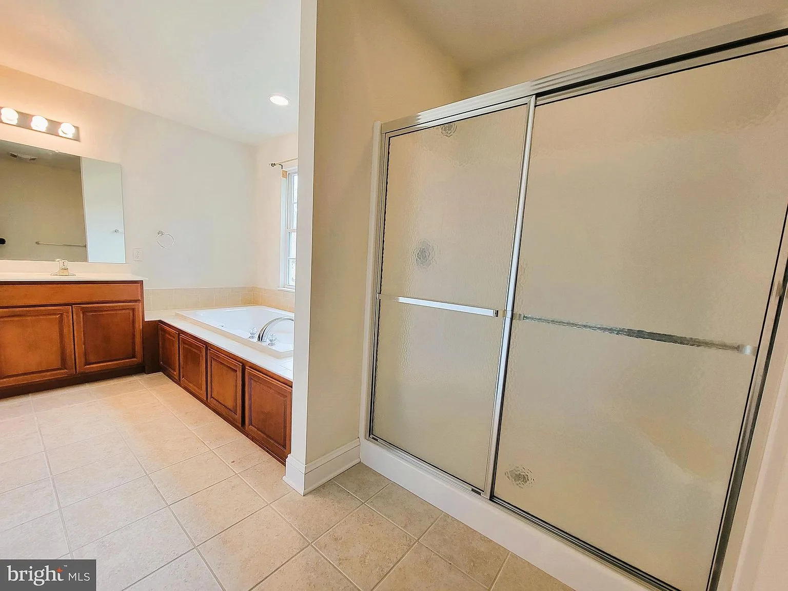 Master bathroom with shower and soaking tub
