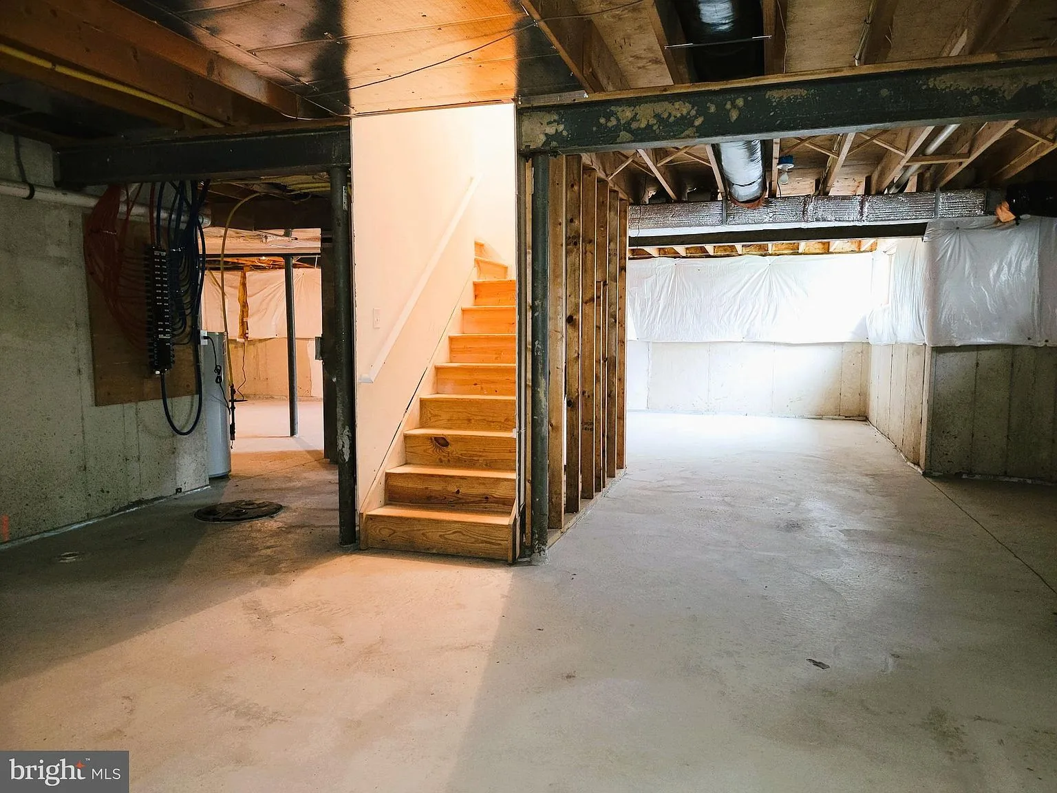 Unfinished basement with exposed joists