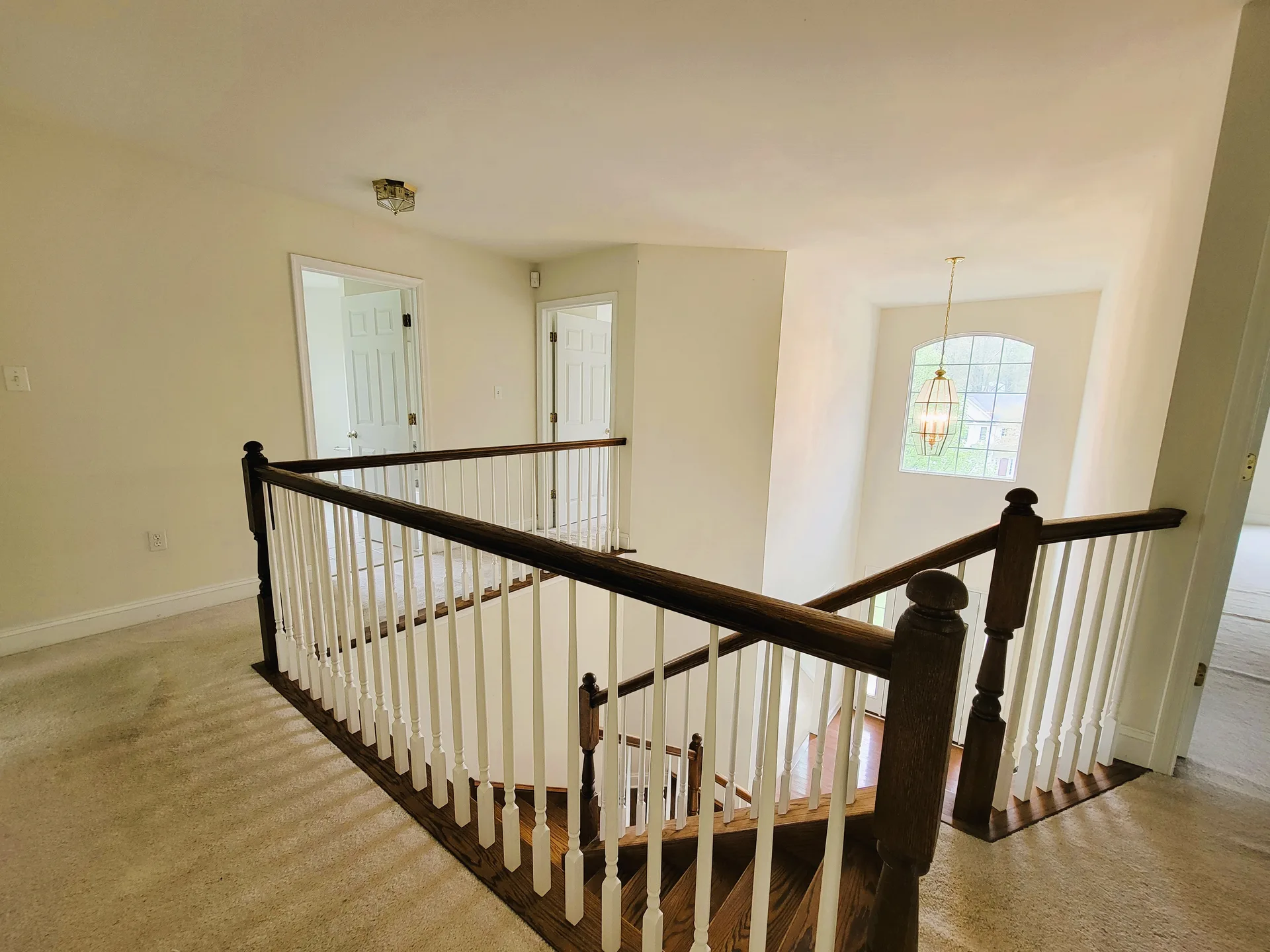 Second-floor hallway overlooking staircase