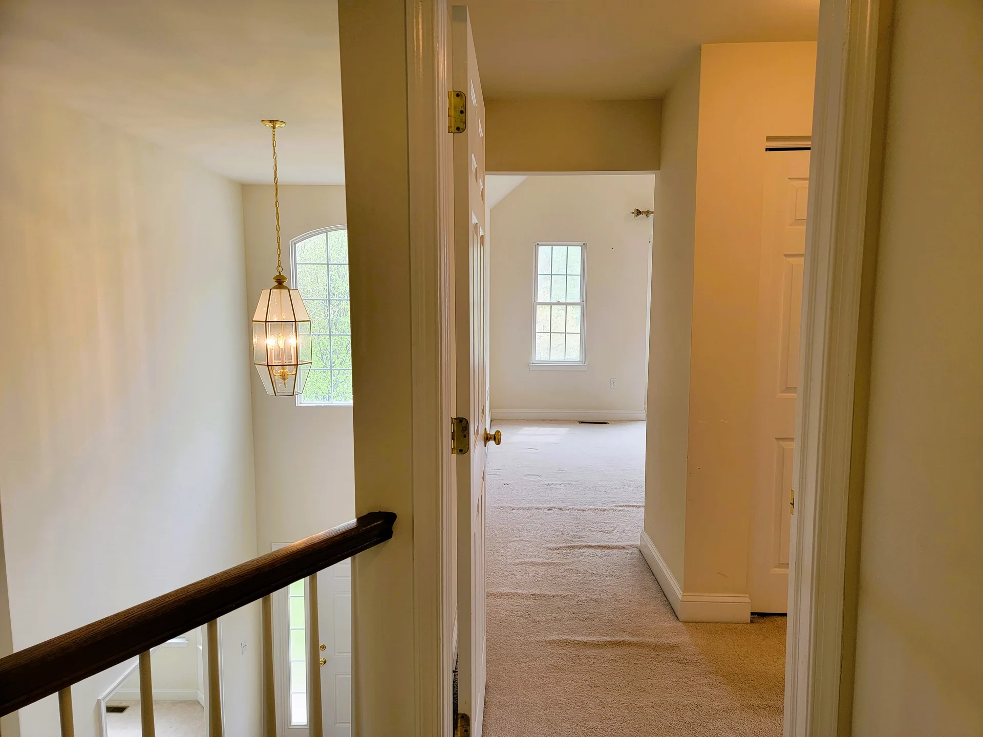 Upstairs hallway landing with chandelier