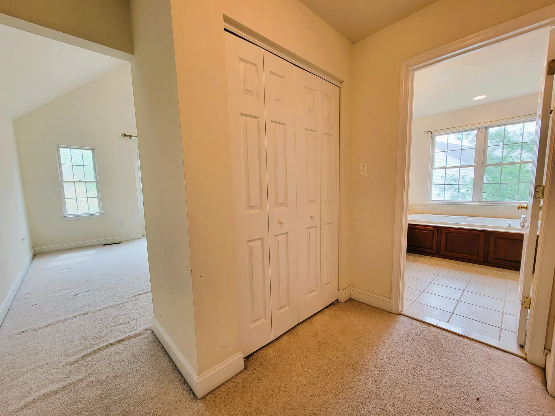 Hallway showing bedroom and bathroom access