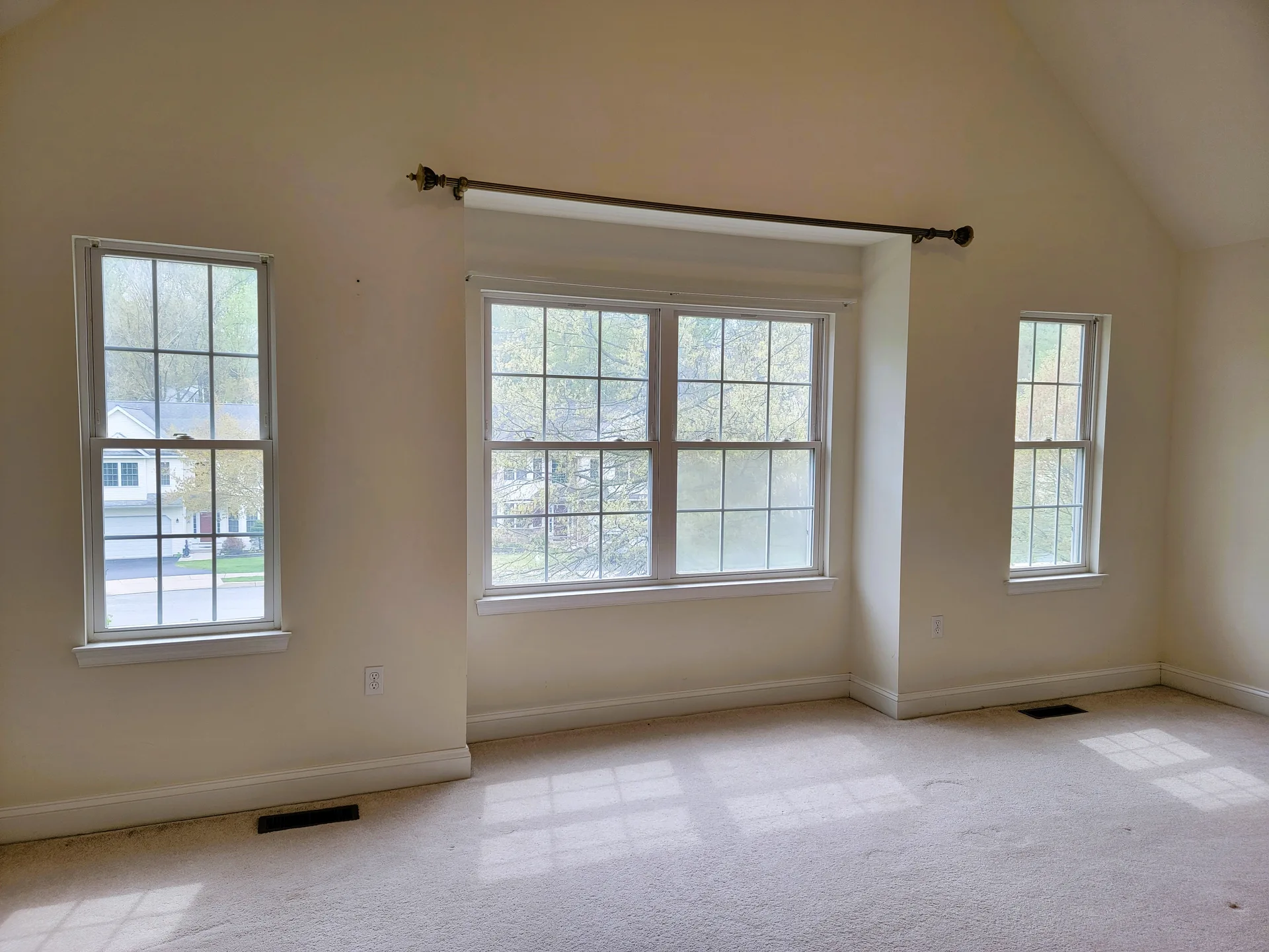 Vaulted ceiling bedroom with natural light