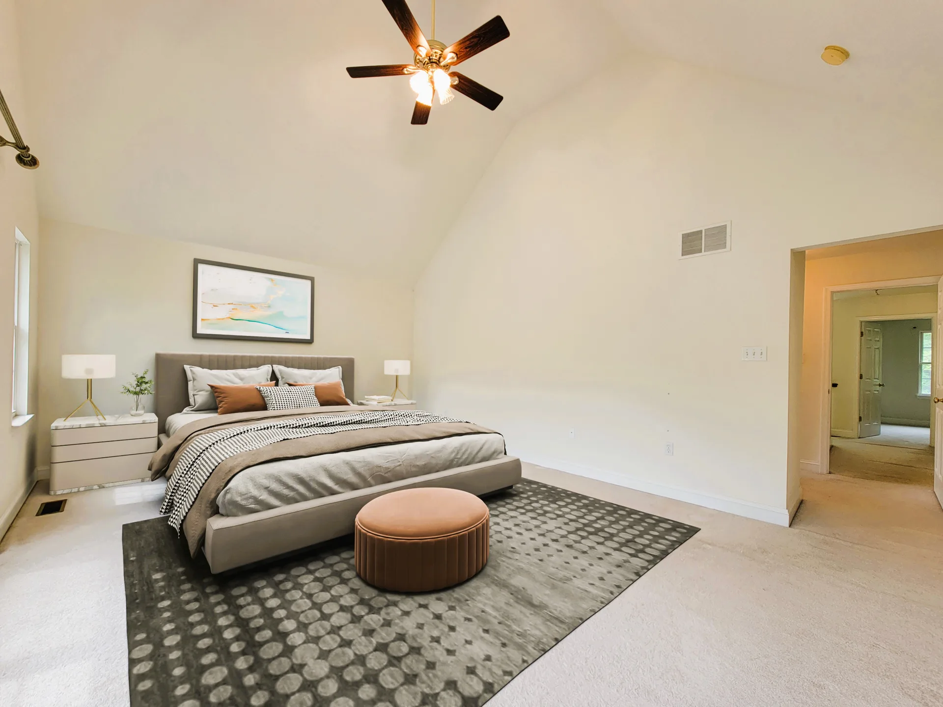 Primary bedroom with king bed and vaulted ceiling