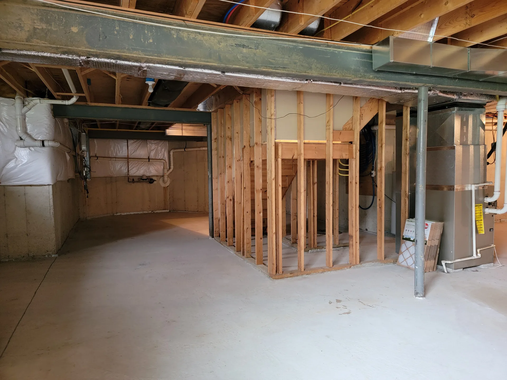 Unfinished basement with framing