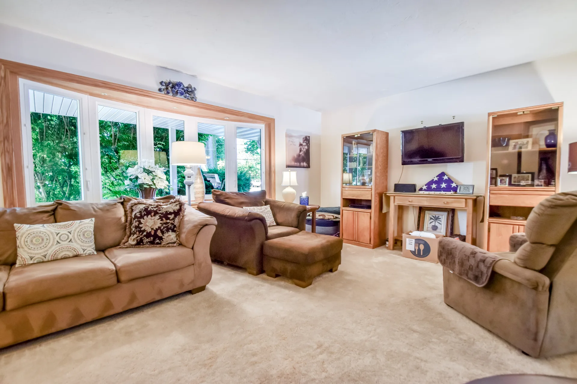 Living room with bay window and wood trim