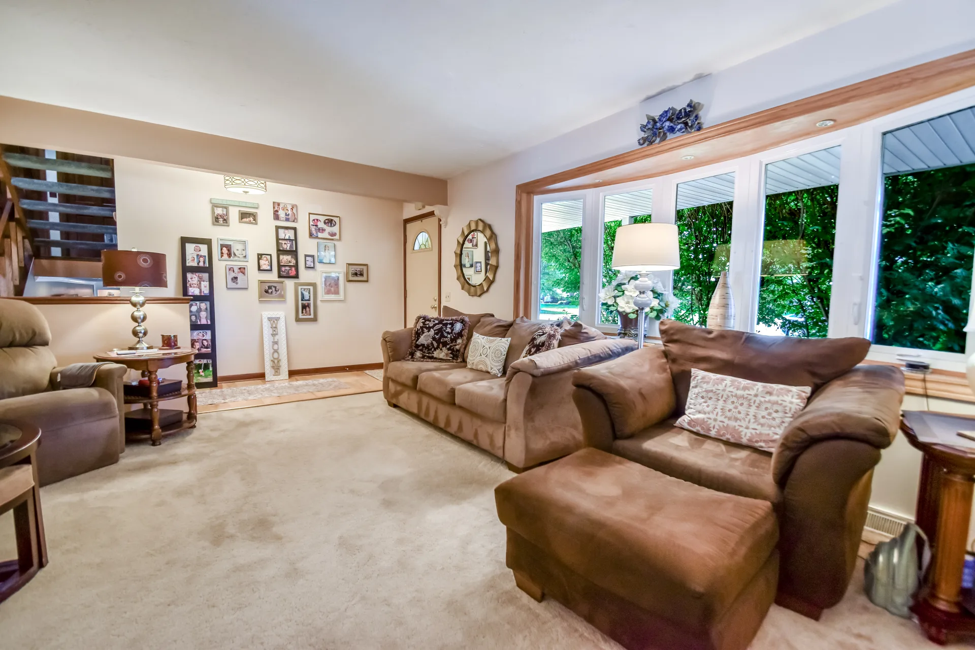 Living room featuring large bay window with natural light