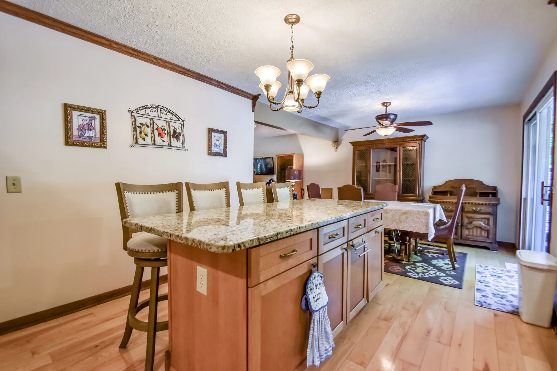 Kitchen and dining combination space with chandelier