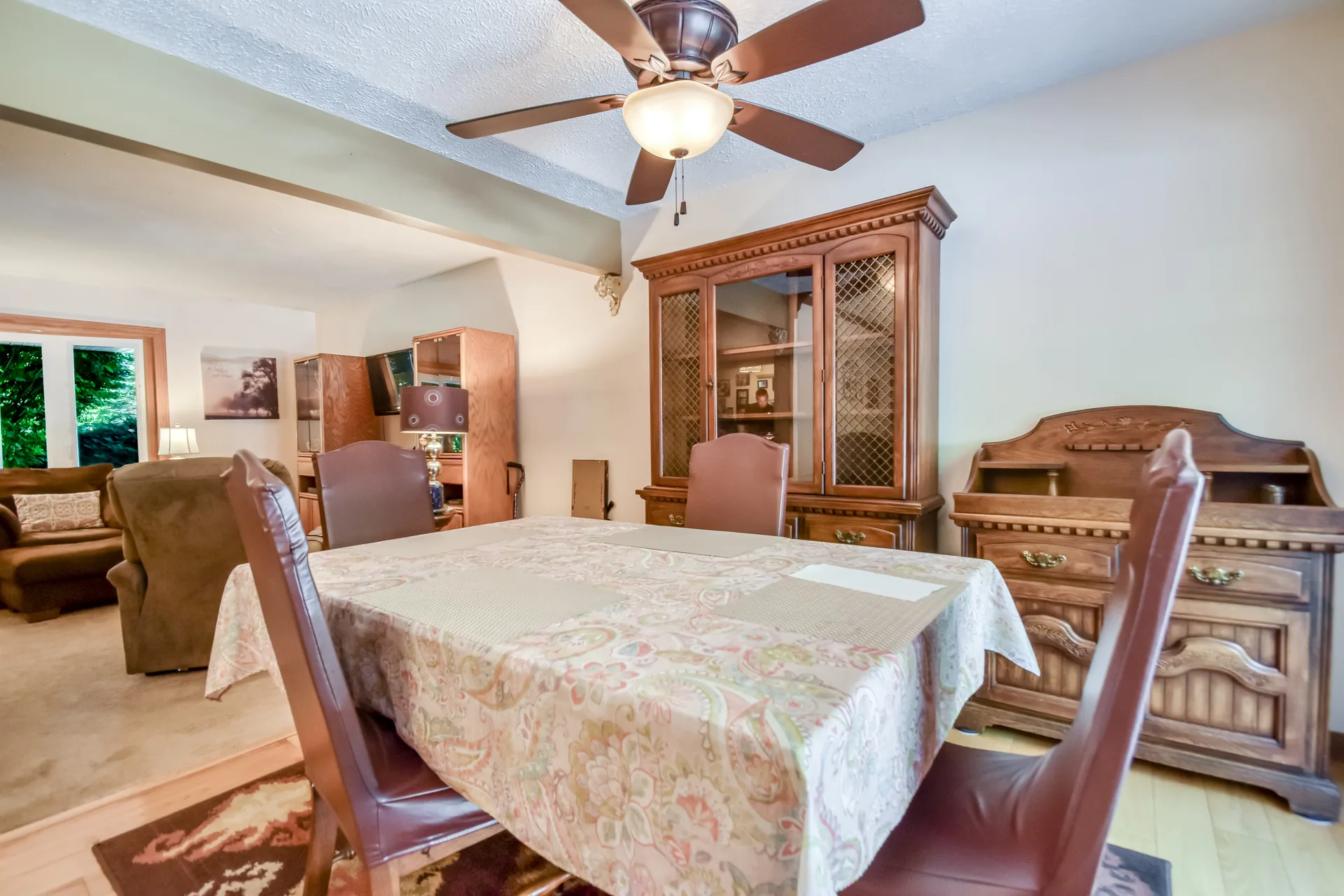 Dining room with china cabinet and hardwood floors