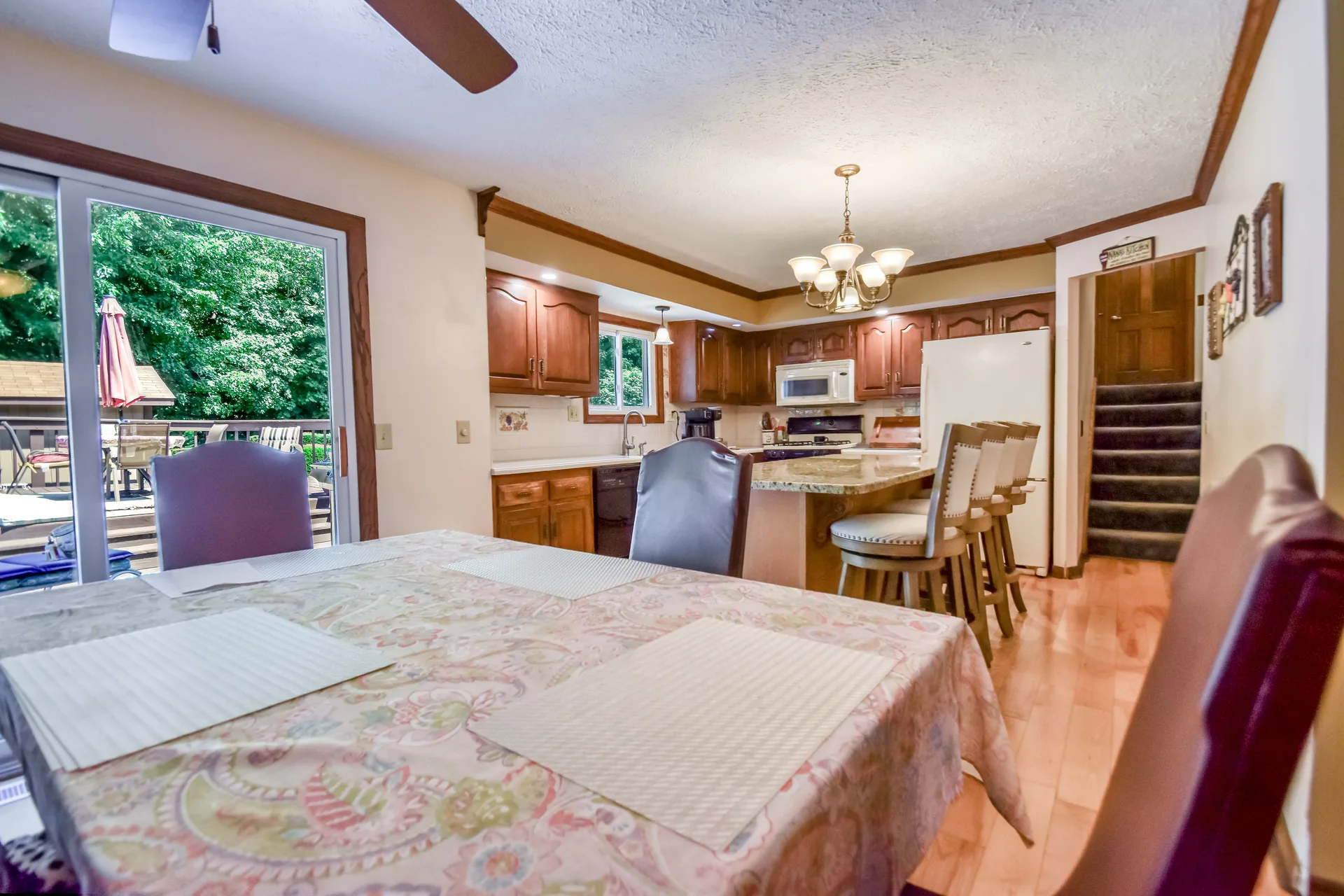 Kitchen and dining space with sliding glass doors