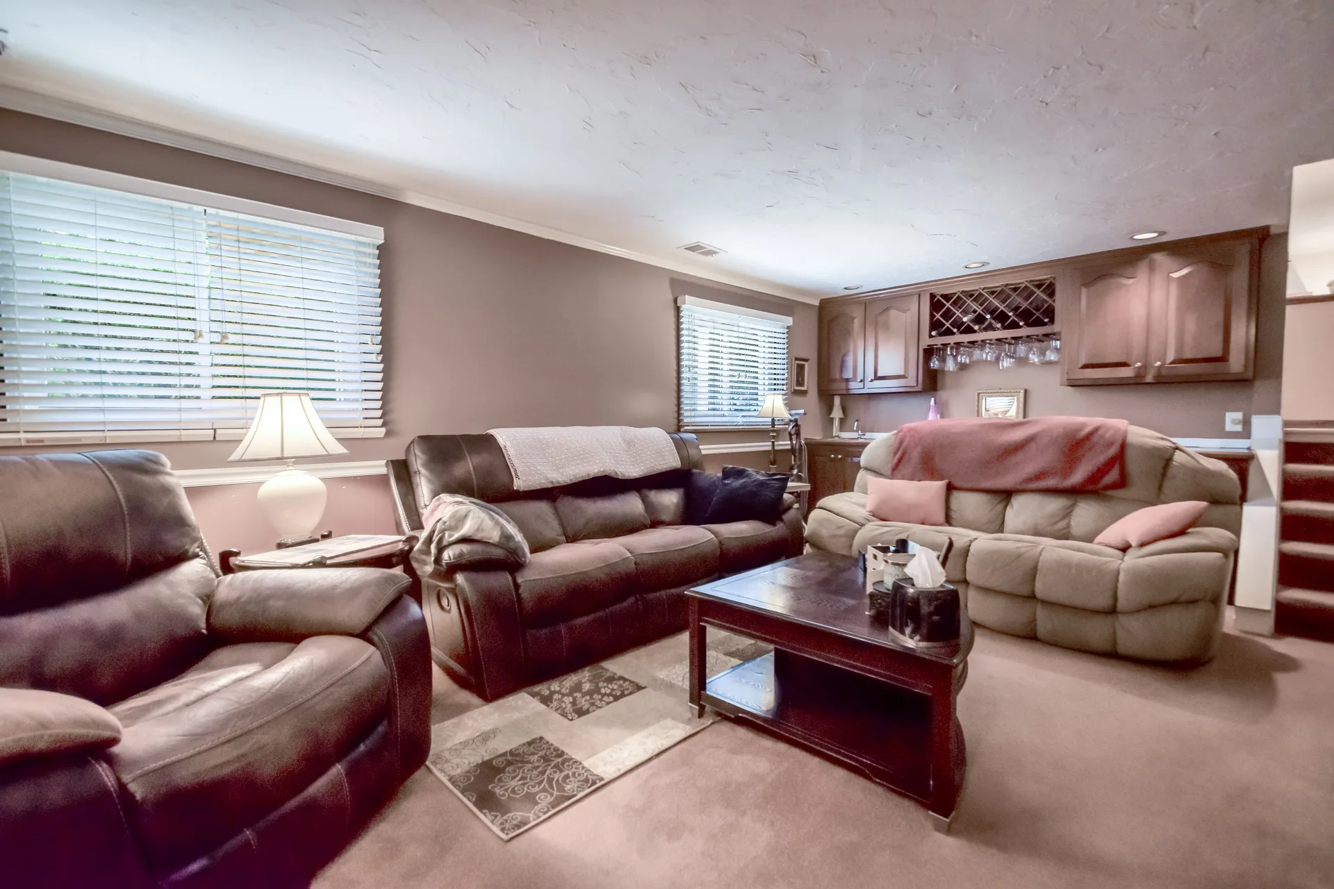 Lower level den with wet bar and wine rack