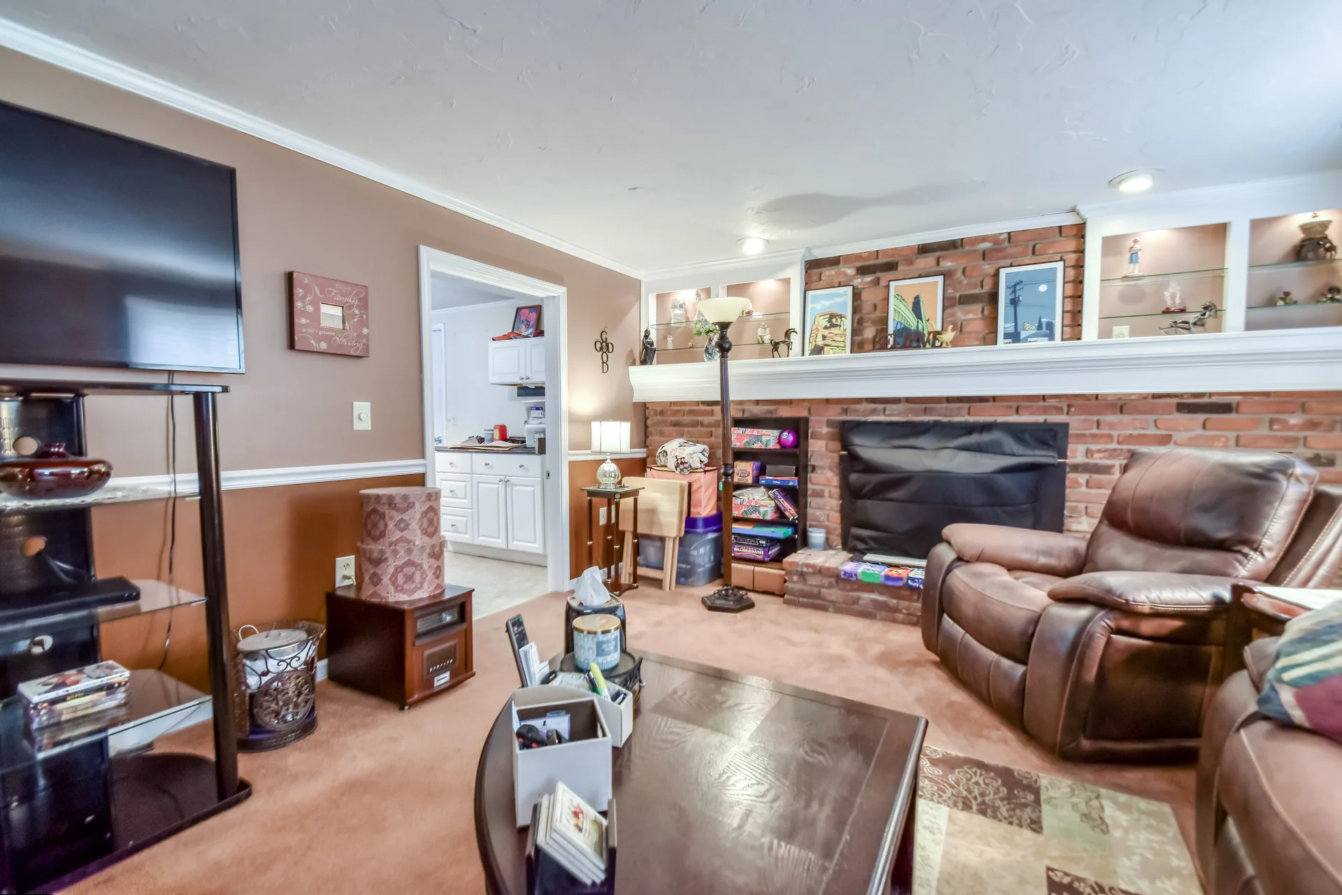Living room view toward brick fireplace