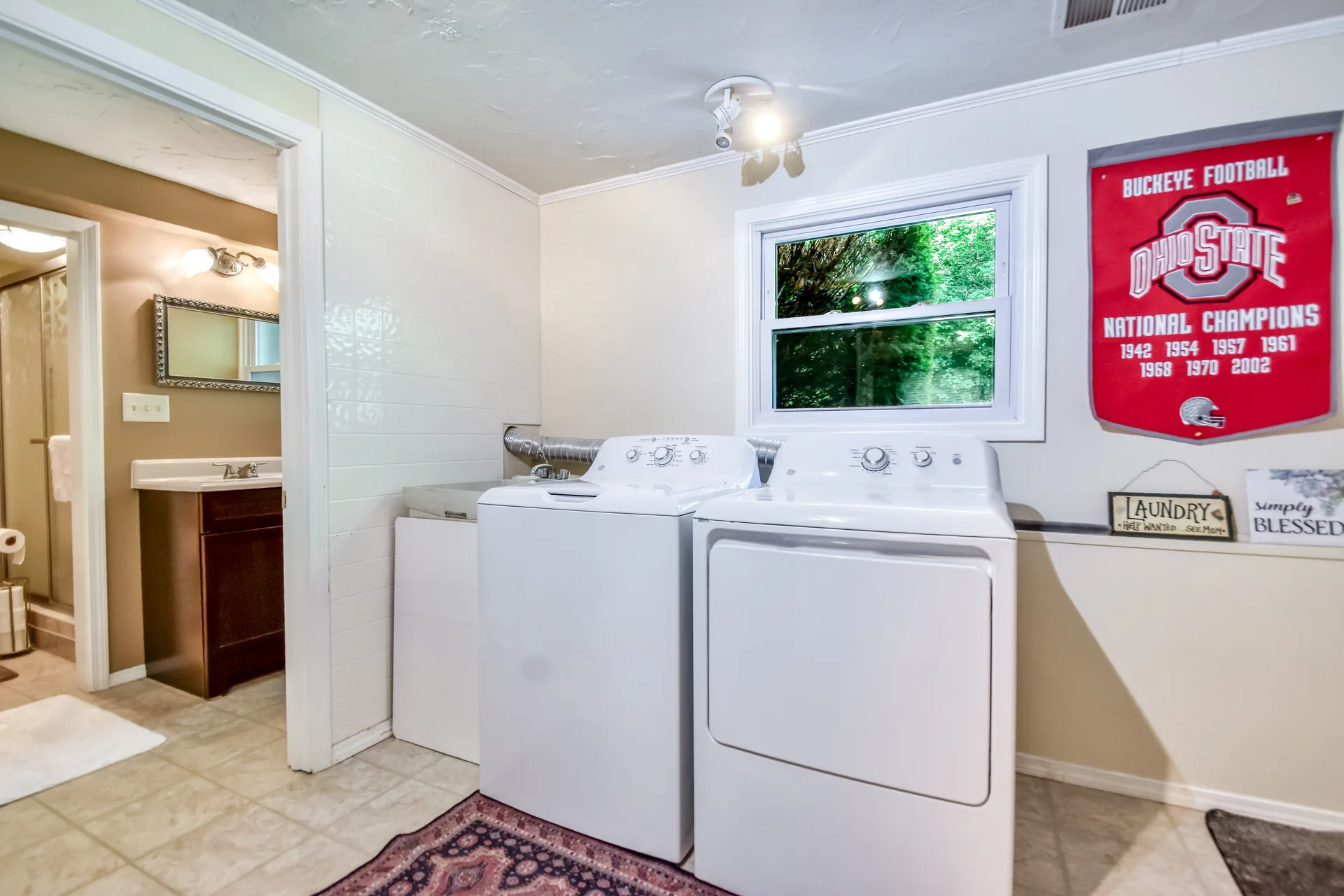 Laundry room with tiled floors