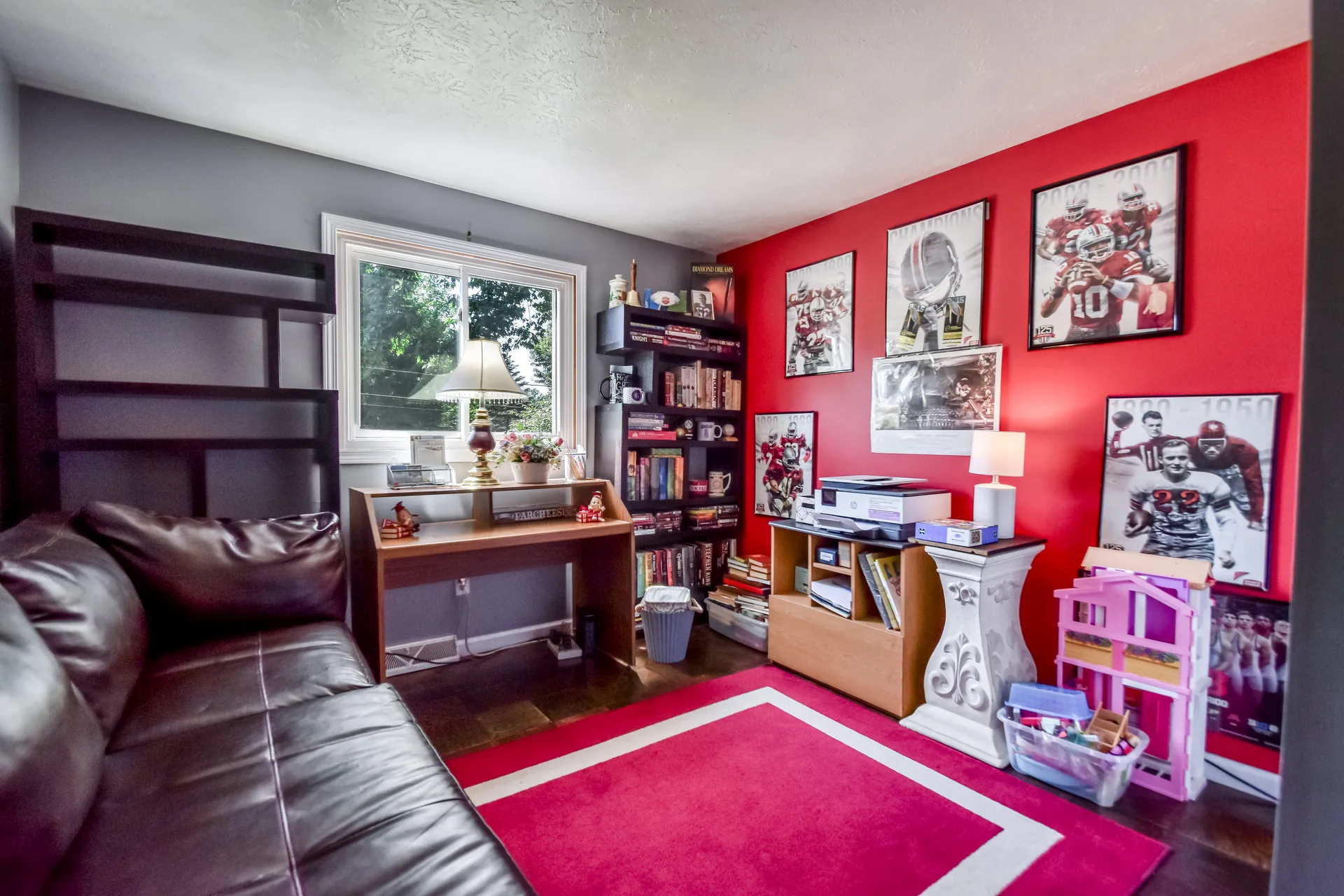 Bedroom converted to office with red and grey walls
