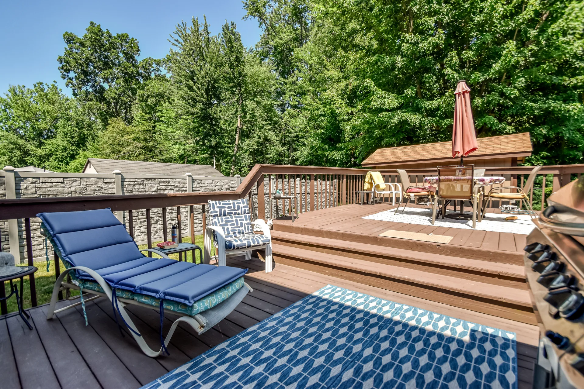 Tiered backyard deck with lounge and dining areas