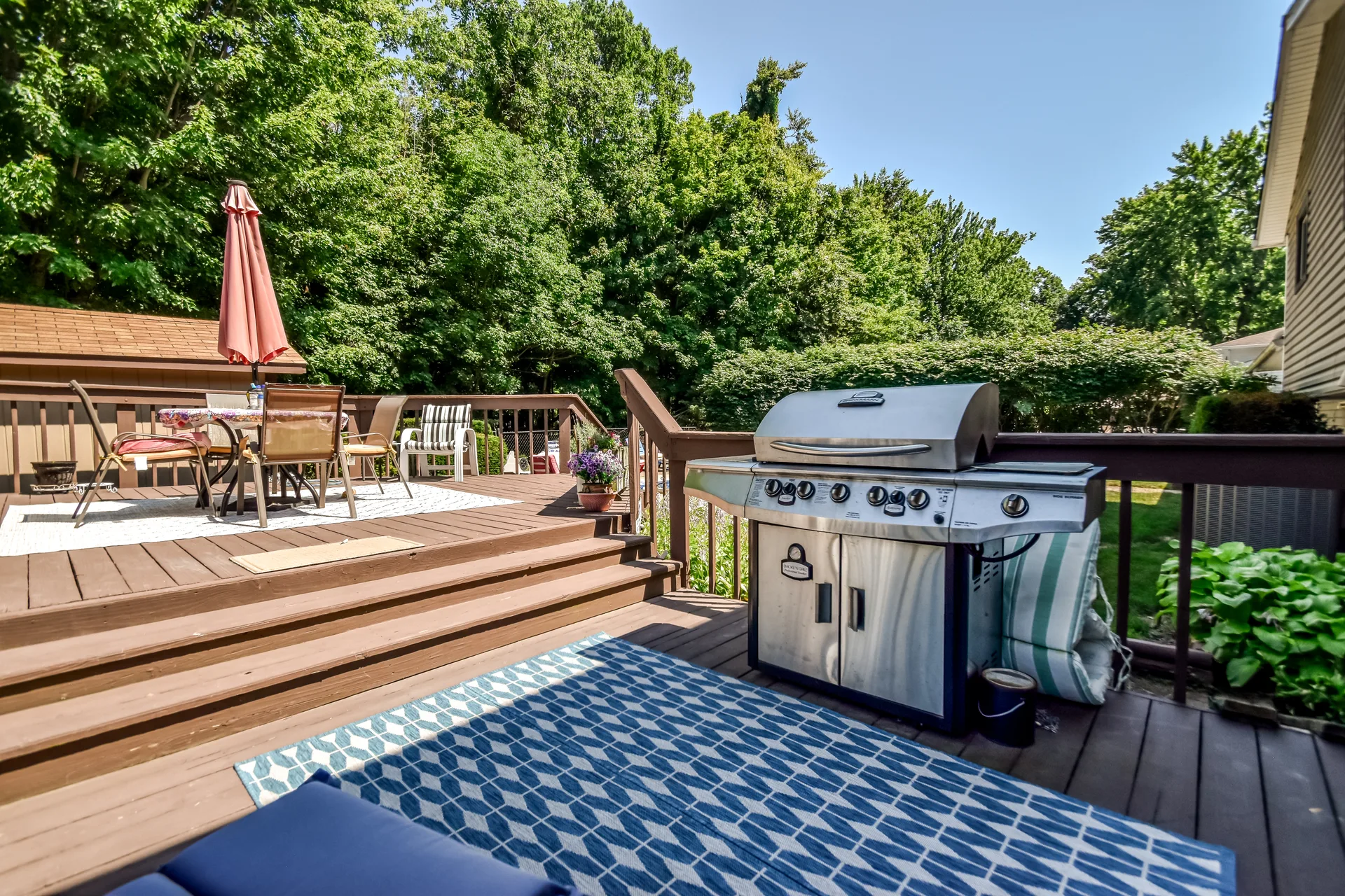 Backyard wooden deck with natural surroundings