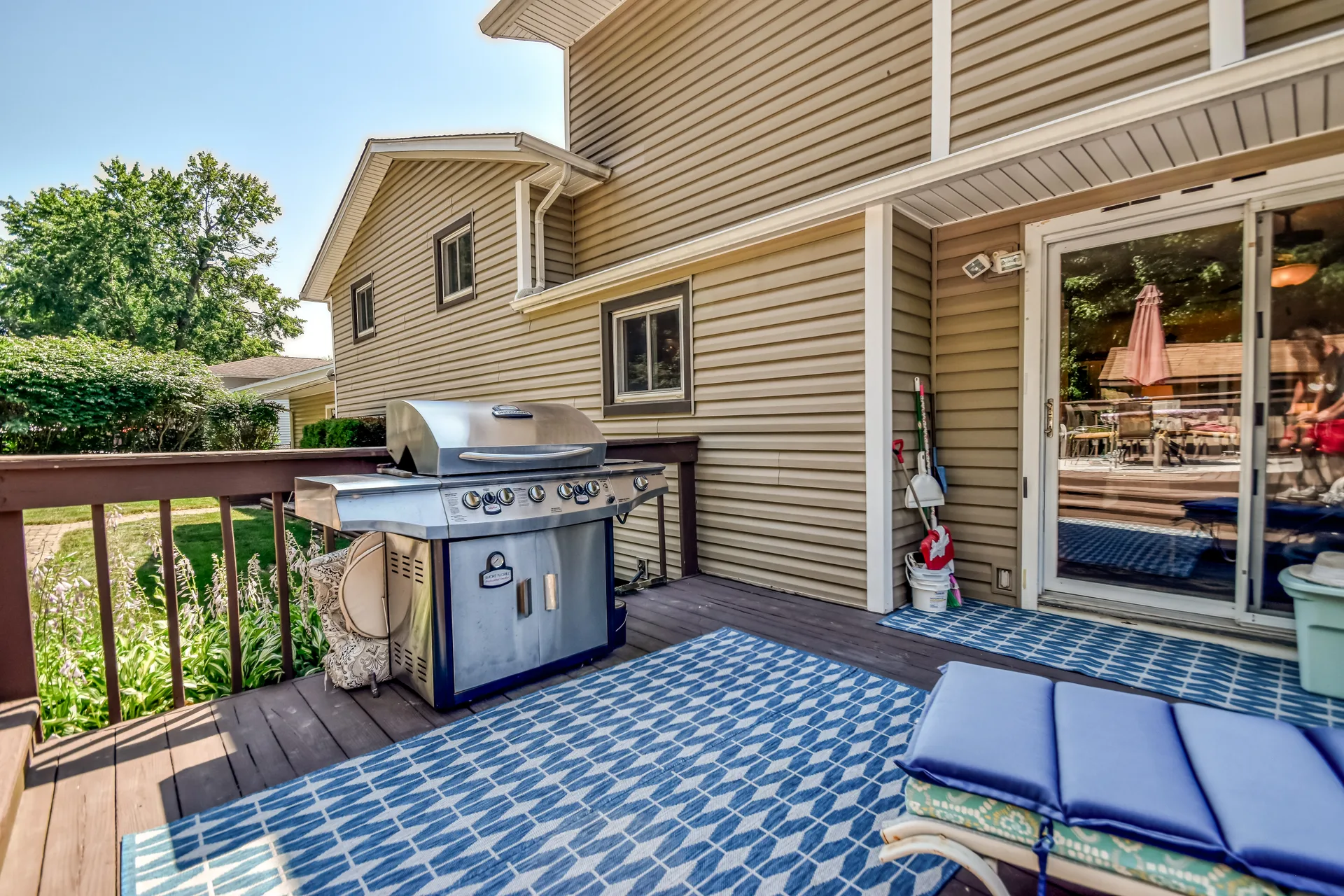 Deck area with BBQ grill and outdoor storage