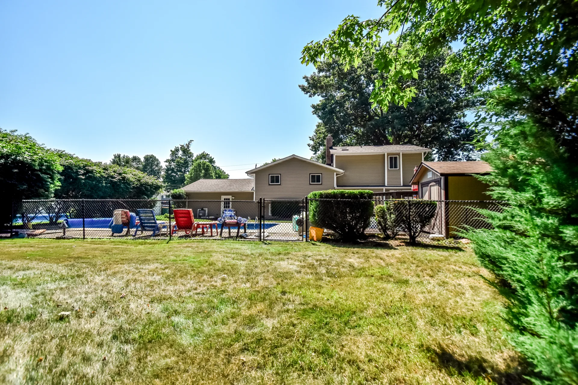 Pool area with seating and storage shed